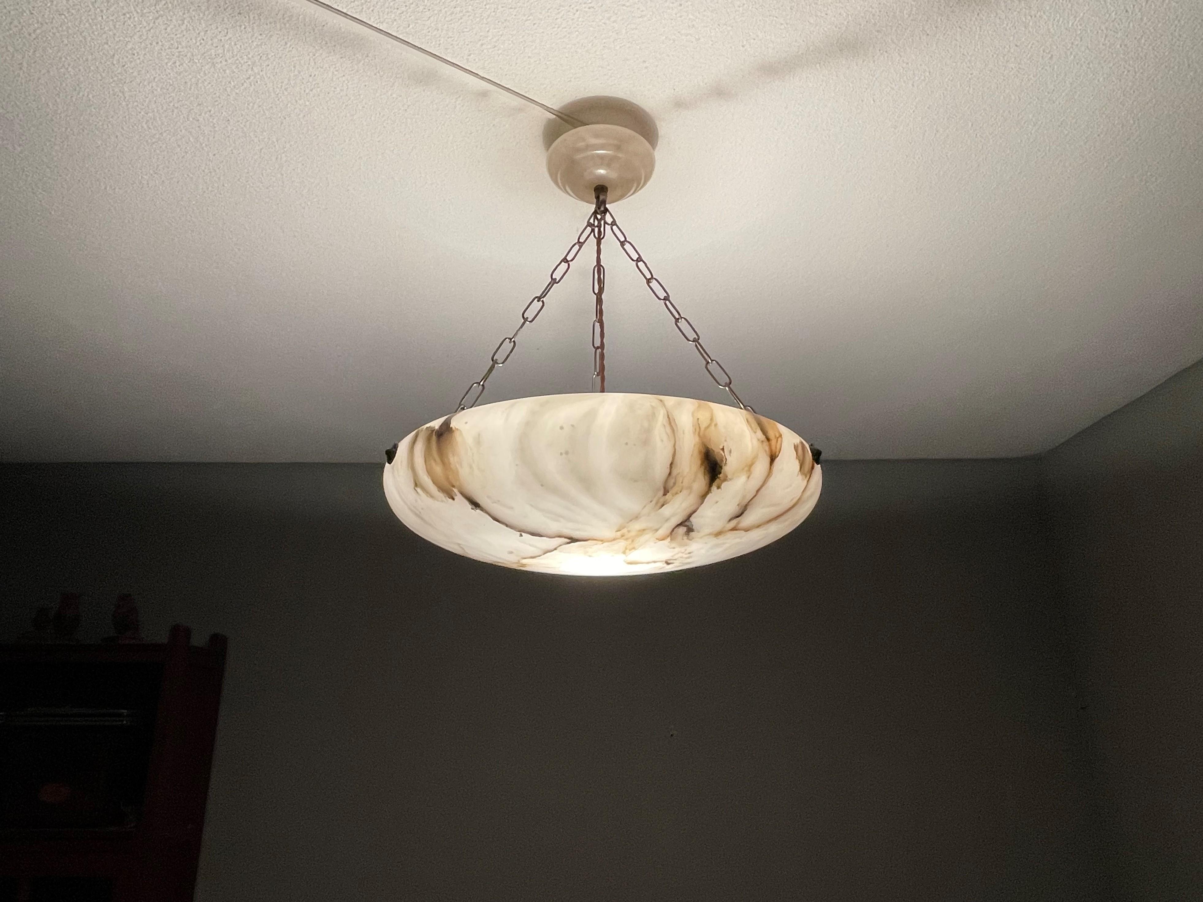 Timeless and large size alabaster pendant / flush mount.

Thanks to its large size, timeless design and good condition this alabaster pendant or flush mount is the perfect lighting solution for many types of rooms and interiors. A remarkably stylish