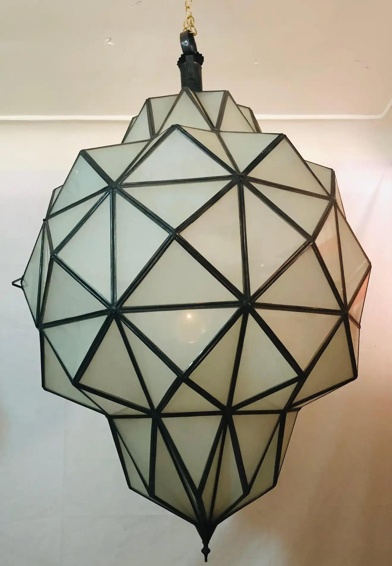 Large Art Deco while milk chandelier, pendant or lantern in dome shape
A stunning Art Deco style dome form milk glass white chandelier or lantern.  Having individual hand cut panes and possessing an open door pane leading to a double recently wired