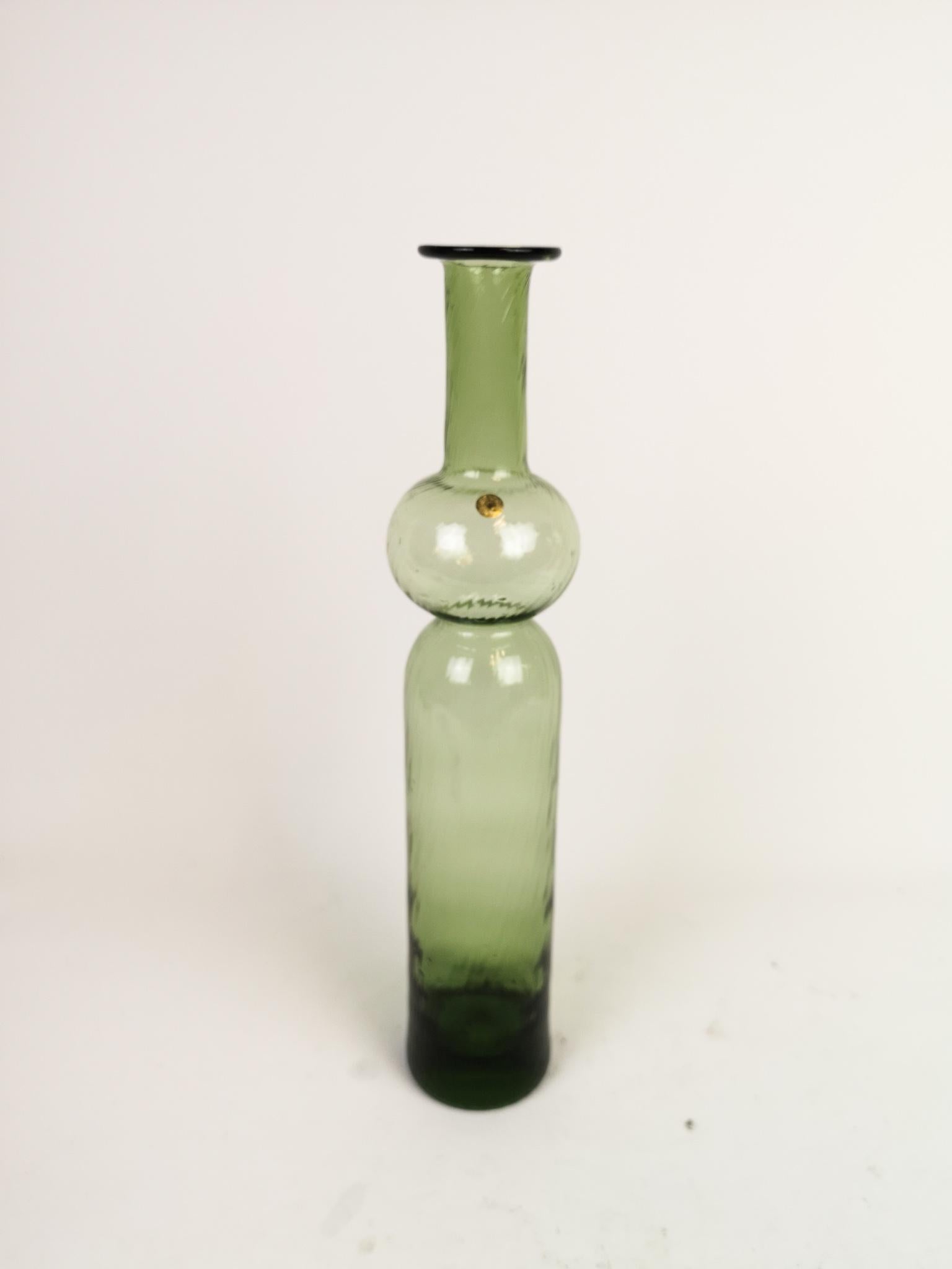 This large art glass bottle is handmade at Riihimäen Lasi Finland and designed by Nanny Still. The name of this green twined bottle is Neptuna.

Good condition

Measures: H 34 cm.
  