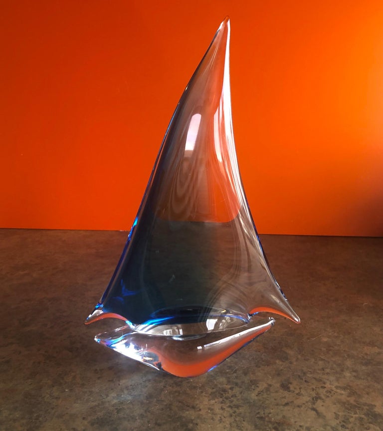 Large art glass Sommerso sailboat sculpture by Murano Glass, circa 1970s. The sailboat is clear glass with a dark blue on one half of the piece; it is 14