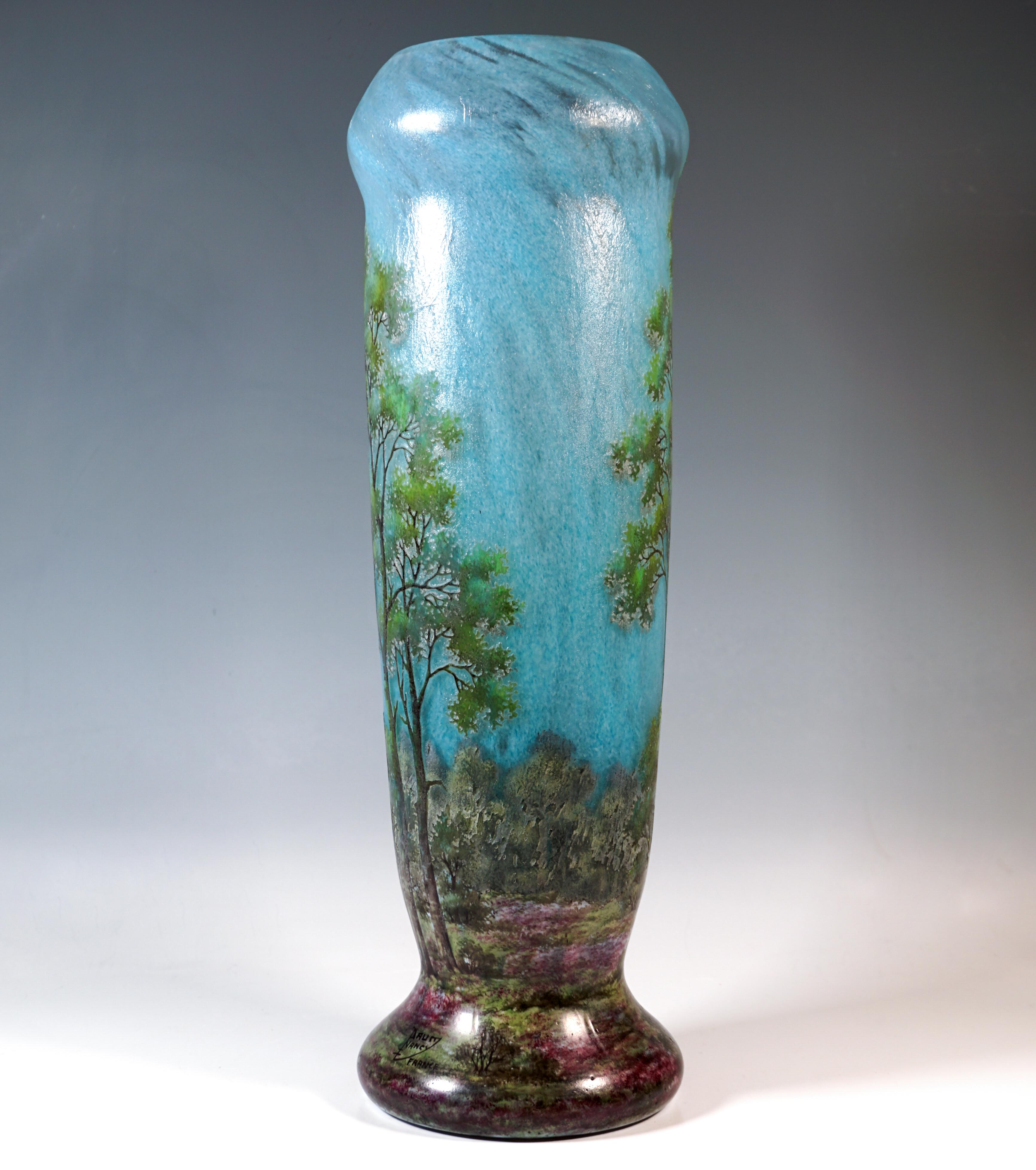 Particularly large Baluster vase on a slightly offset base, colourless glass with flaky sky blue powder melting, green overlay, spring landscape etched in several stages and finely painted with coloured enamel, satin finish in the background,