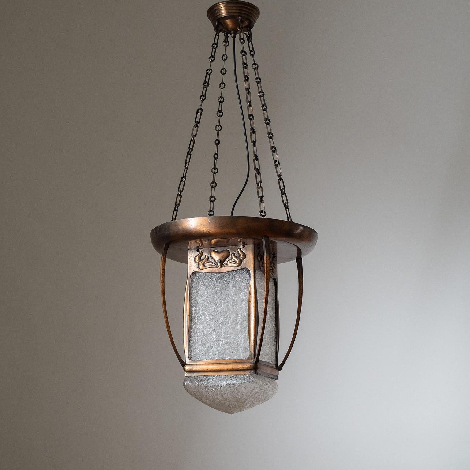 Rare Art Nouveau or Jugendstil Lantern from the early 20th century. All copper construction with a large textured glass diffuser. The large body is suspended by four copper chains and can easily be height adjusted. One original brass and ceramic E27