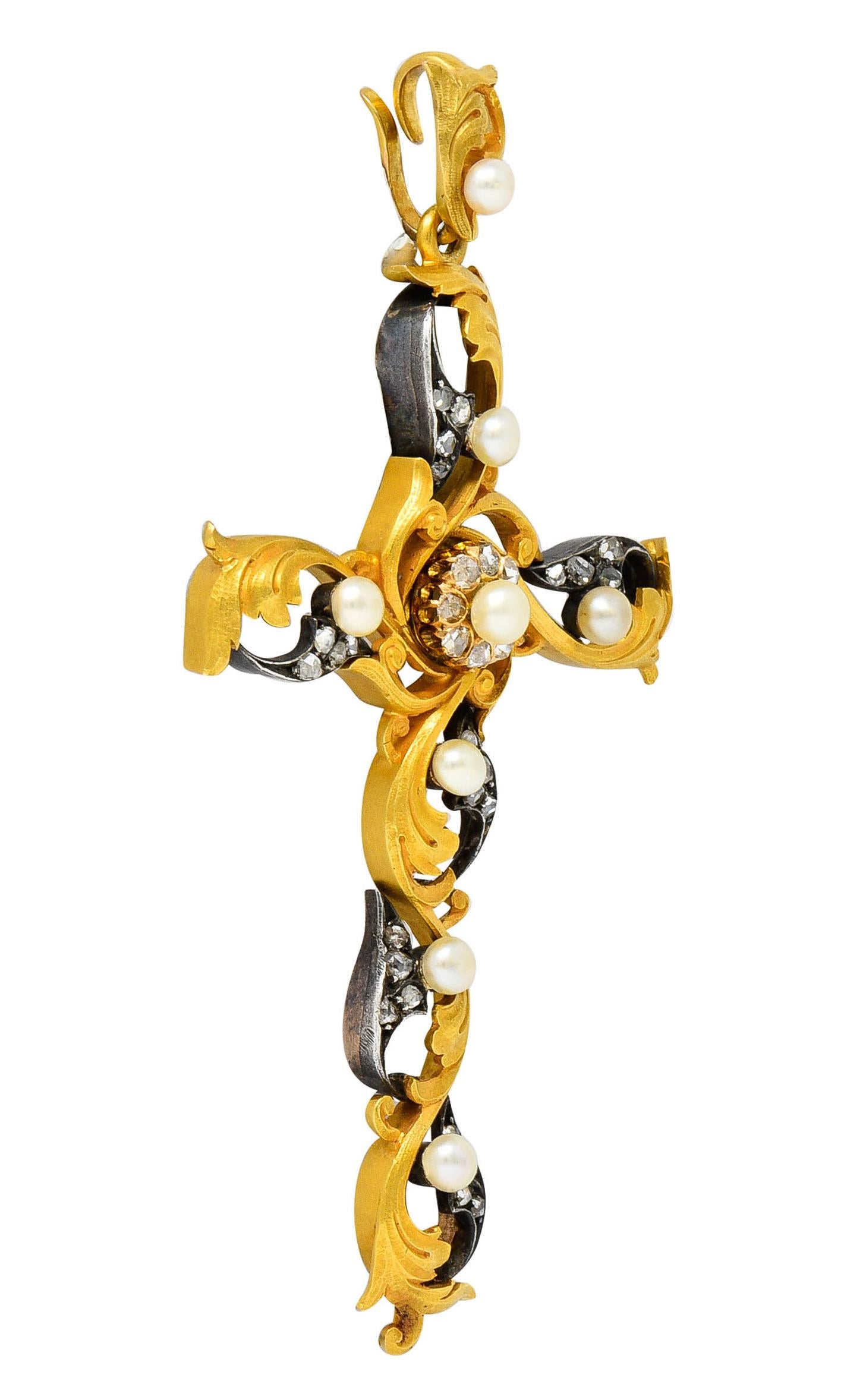 Substantial cross pendant is comprised of oxidized silver and matte 18 karat gold; tested

Each extension is two-toned with scrolling foliate whiplash

Featuring eight 4.0 mm round button pearls with well-matched cream color and very good