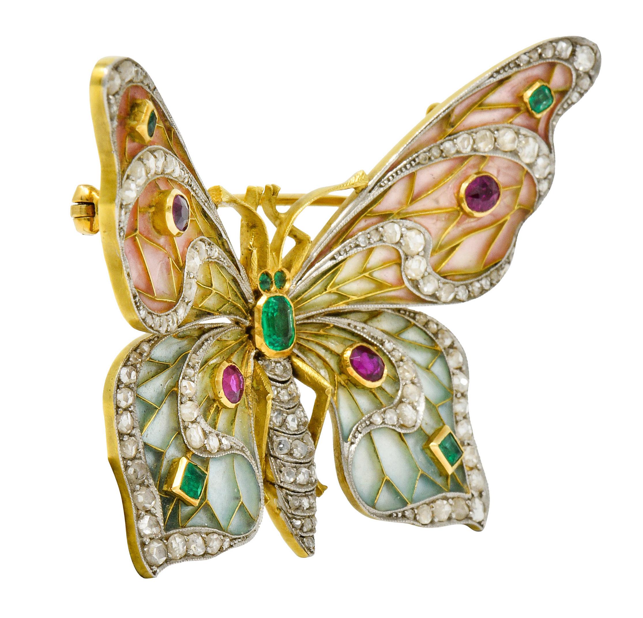 Designed as a butterfly with beautiful translucent plique-a-jour wings

Pastel ombrè pink, yellow, green, to blue color with minor loss consistent with age

Wings are embellished with polished gold veining and platinum; bead set with rose cut