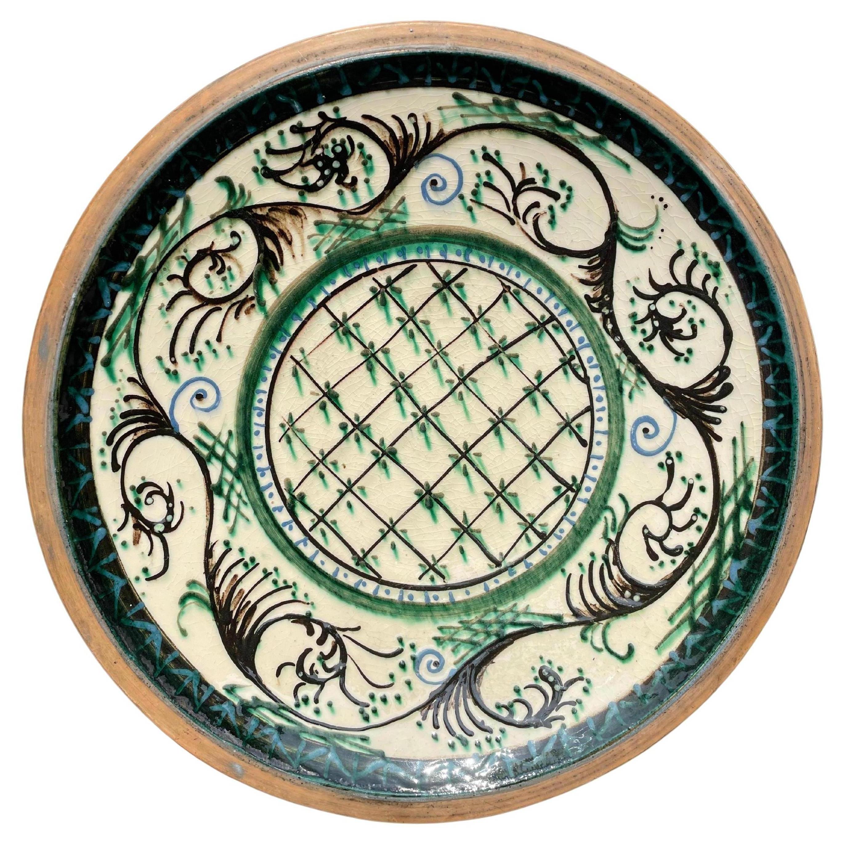 Large handmade Art Nouveau ceramic wall plate / centerpiece bowl manufactured in Denmark in the 1930s. Thick cow horn glaze applied by hand in cream, brown, blue and green colors. Two holes on the back for wall hanging. Signed under base. Beautiful