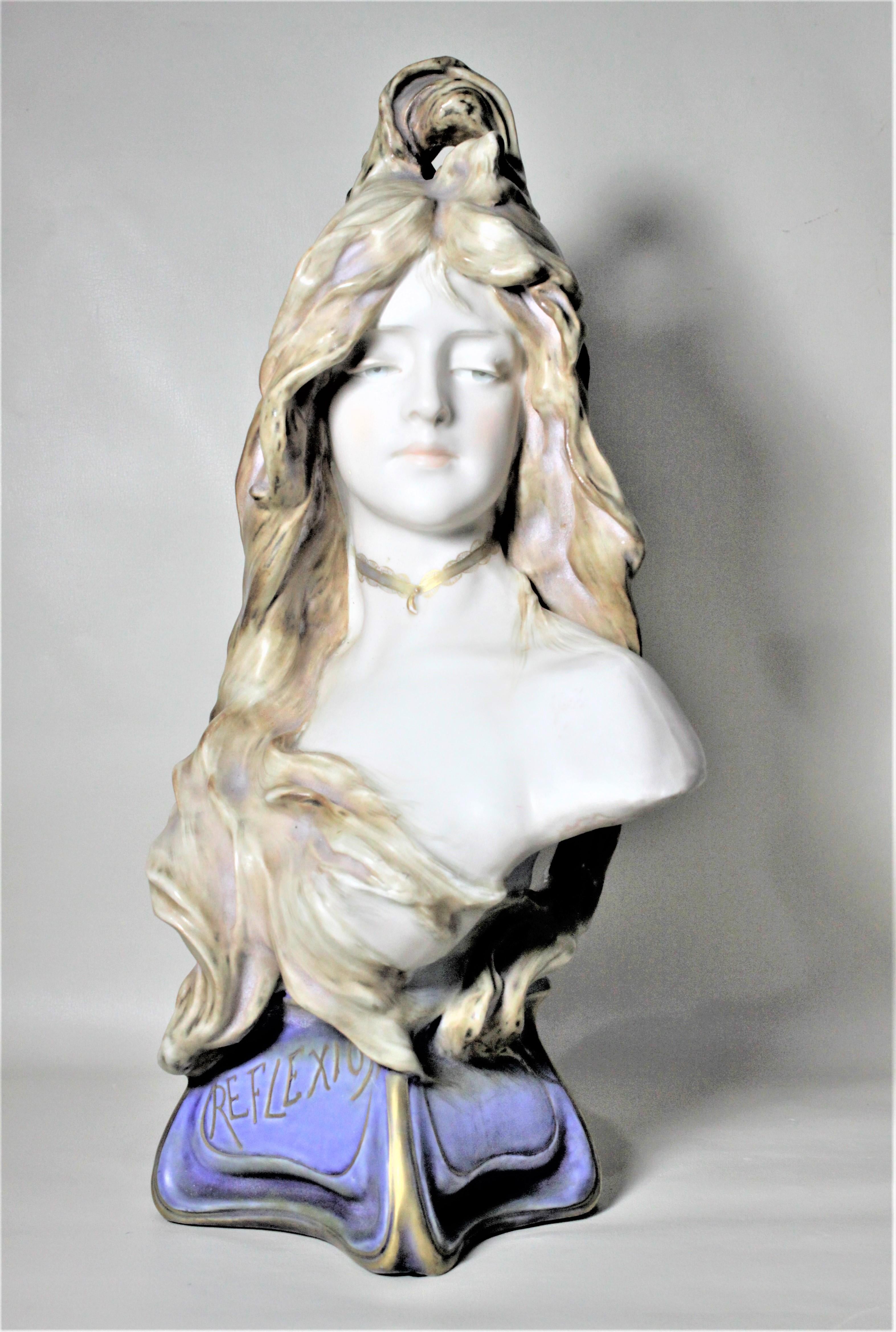 This large porcelain sculpture of a young female was produced by the Teplitz factory of Bohemia in the period and style of Art Nouveau. The bust depicts a young female in contemplation and entitled 