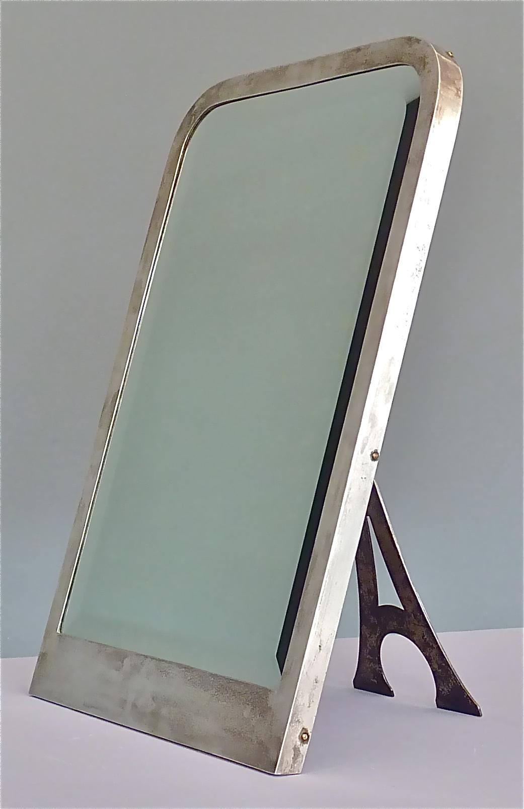 Large signed Arthur Krupp Berndorf table mirror, Jugendstil Art Nouveau, Germany circa 1905-1915. The mirror is made of silvered brass, original beveled faceted mirror glass and wood. Beautiful detail on reverse with an Eifel tower shape mirror