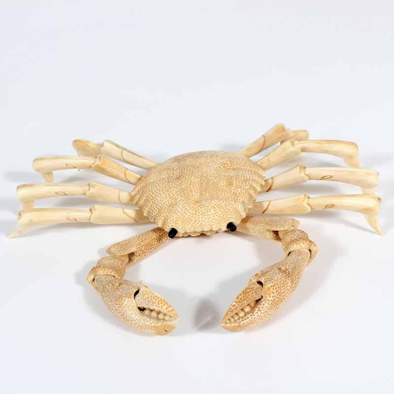Intriguingly realistic and stunningly detailed articulated crab carved out of bone. Legs and arms extend inwards and outwards.