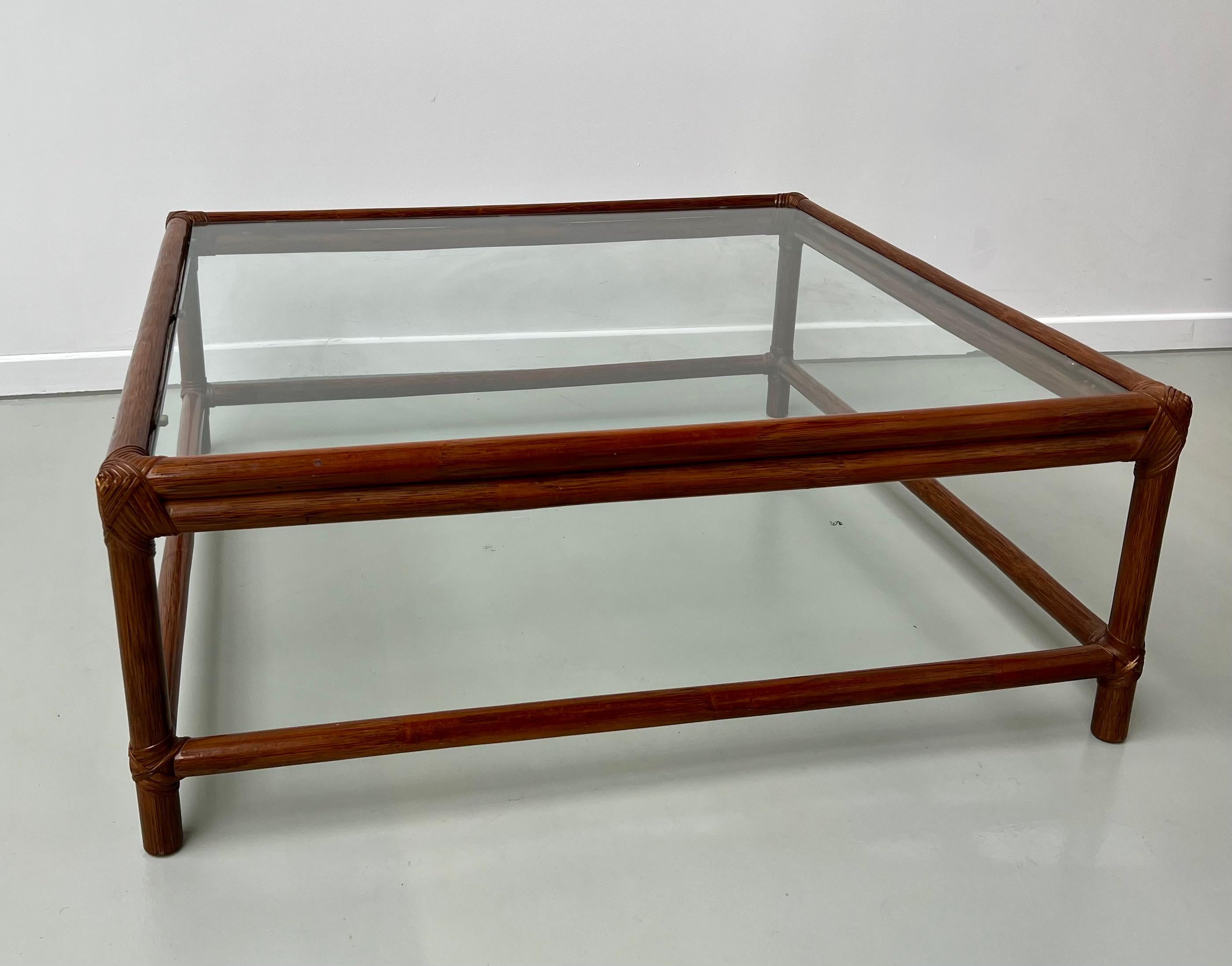 This superb coffee table is in very good vintage condition. Made by a craftsman in the 70s in France, its glass top rests on pretty period cleats. Highly decorative and furiously trendy with the cachet of a 70s piece.