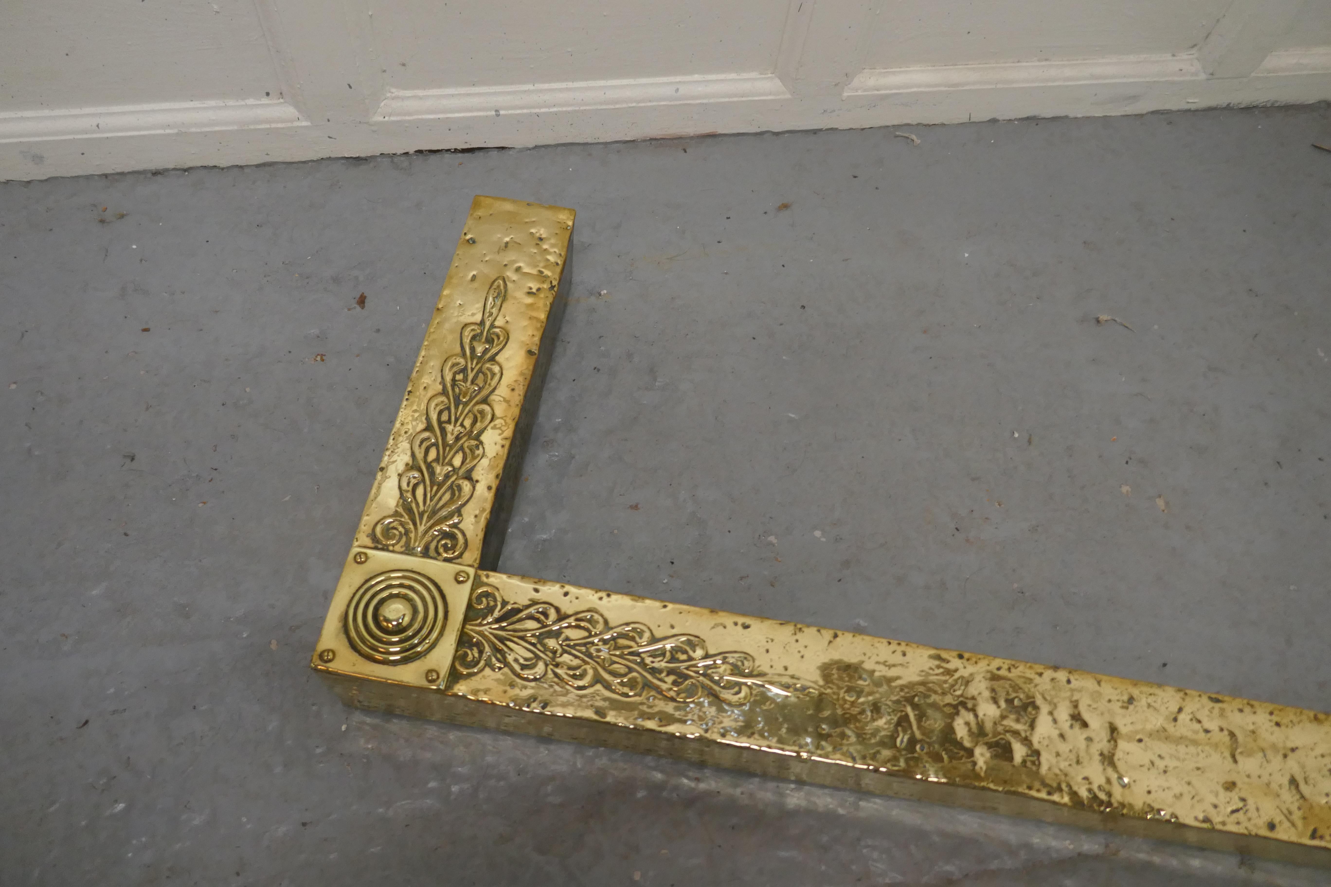 Large Arts and Crafts brass fender

This is a good large Victorian beaten brass fender it has Art and Crafts decoration, a roundel and swag decoration worked in the brass at the corners
The fender is in good condition it is 3” high, and 57” long