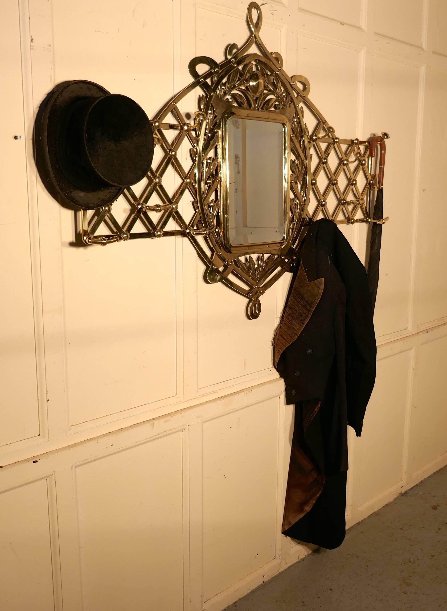 Large Arts & Crafts brass hall mirror, wall hanging coat and hat sand 

This an exceptional piece both on size and quality, the frame is made from woven lattice of brass, set with two styles of coat and hat hooks, (12 in all) this will give you