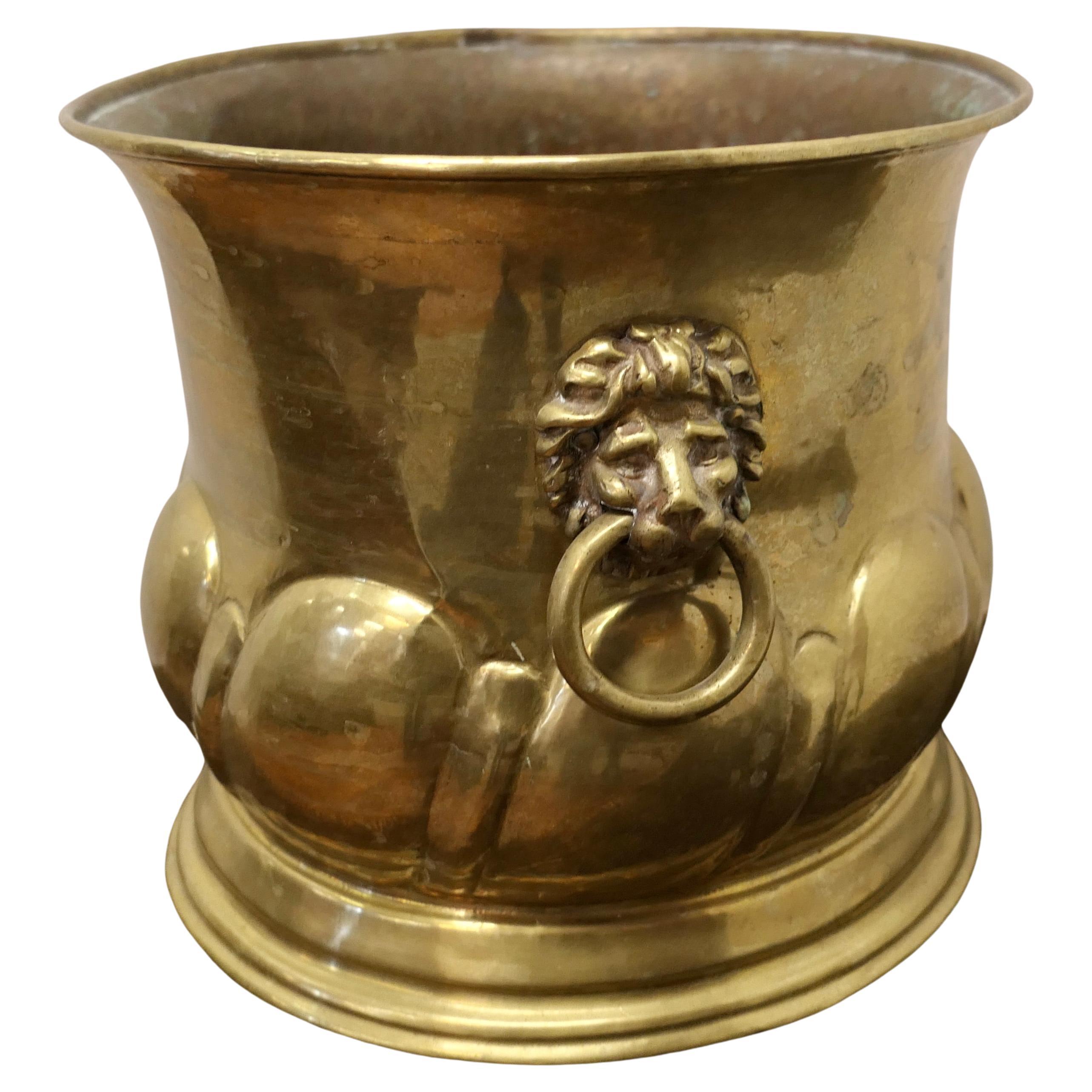 Large Arts and Crafts Brass Jardiniere with Lions Mask Handles  For Sale