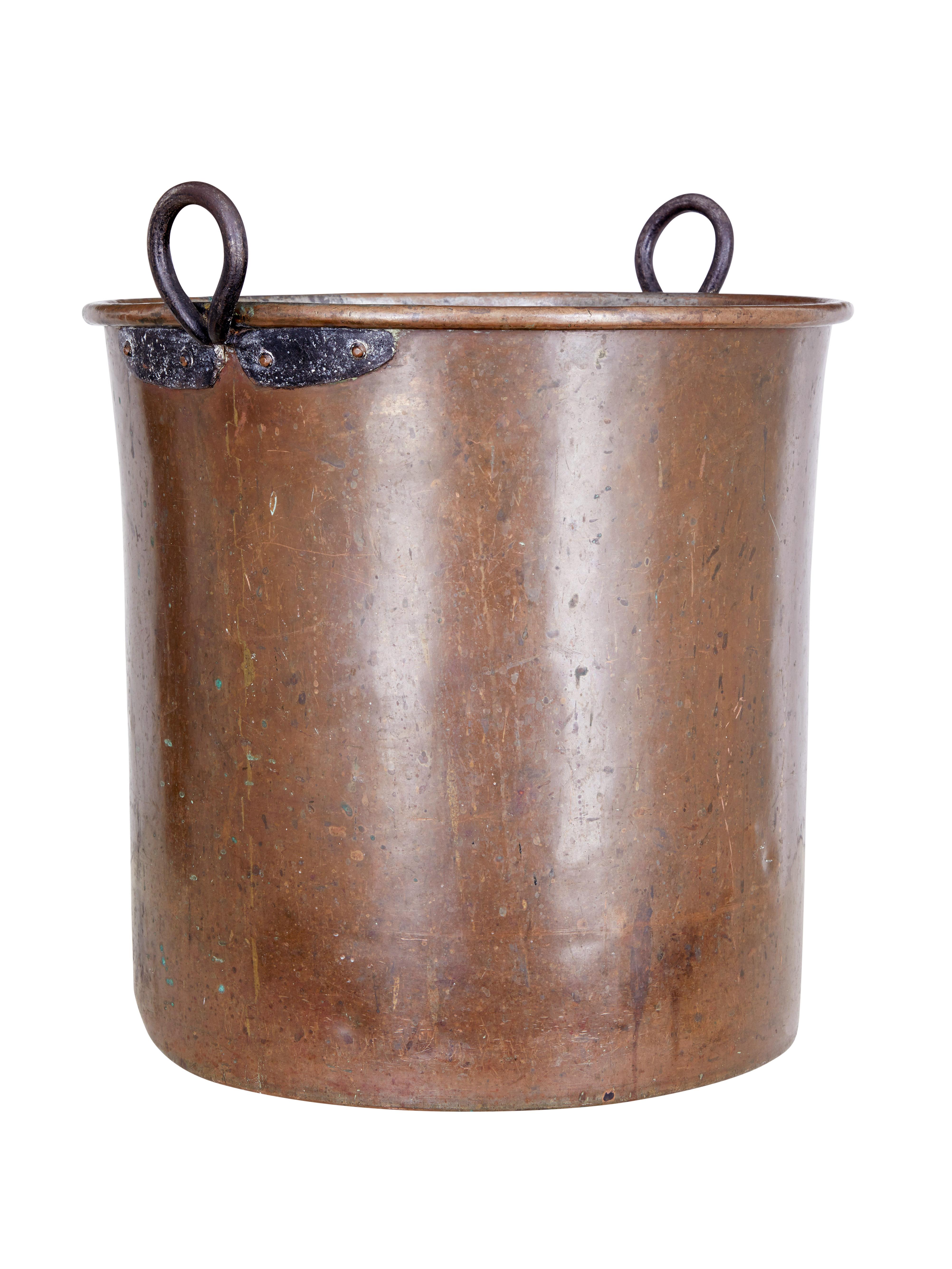 Large Arts & Crafts copper log bin circa 1890.

Likely to be a former milk churn, this impressive piece of metal work now minus its lid makes and ideal log bin or statement wastepaper basket.

Copper with steel handles fitted to the