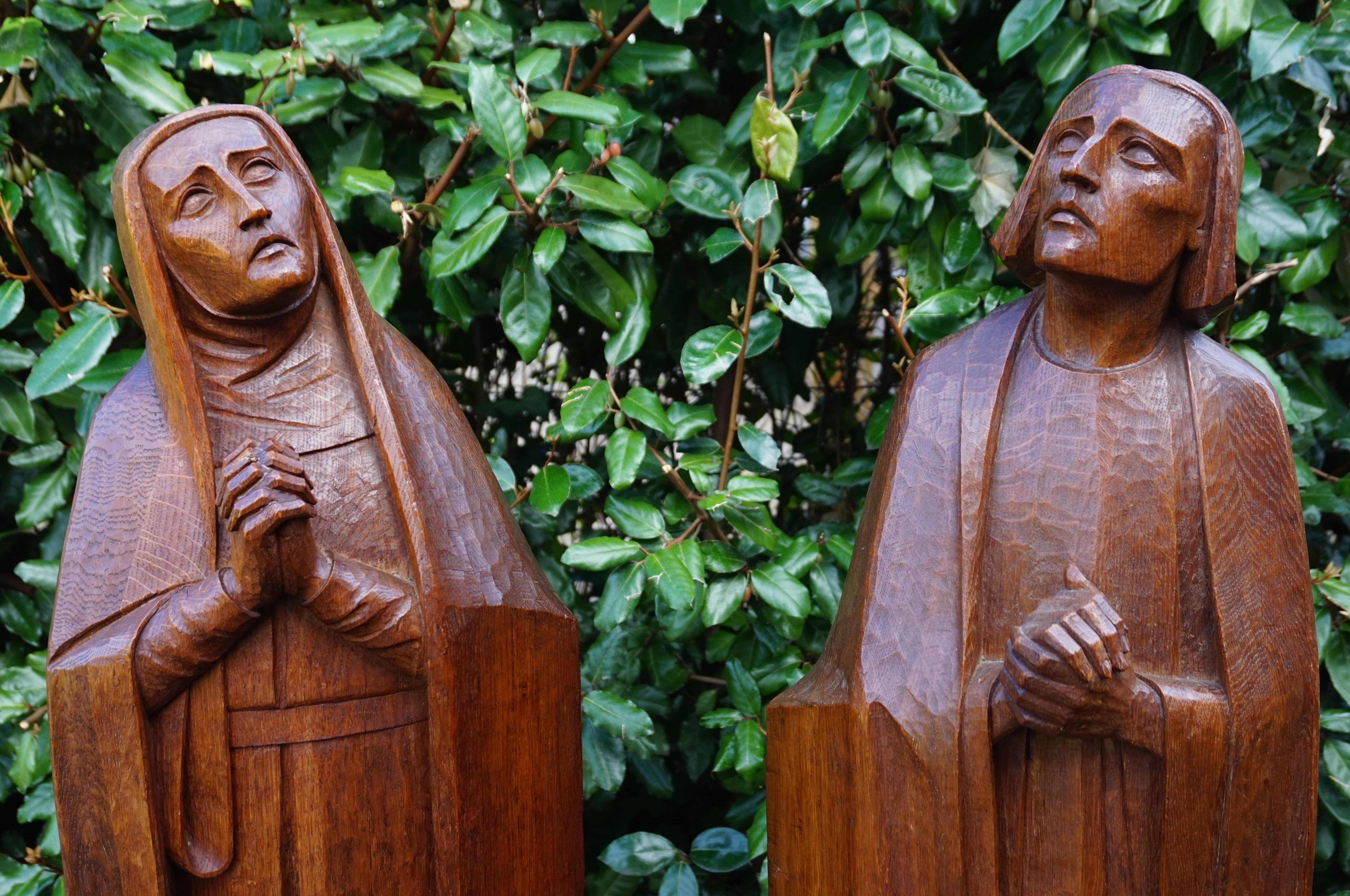 Large and impressive church altar sculptures of Mother Mary and Saint John.

These large and striking, mourning Mary and Saint John sculptures were once part of a church altar set. The partially flat sides of these works of religious art once stood