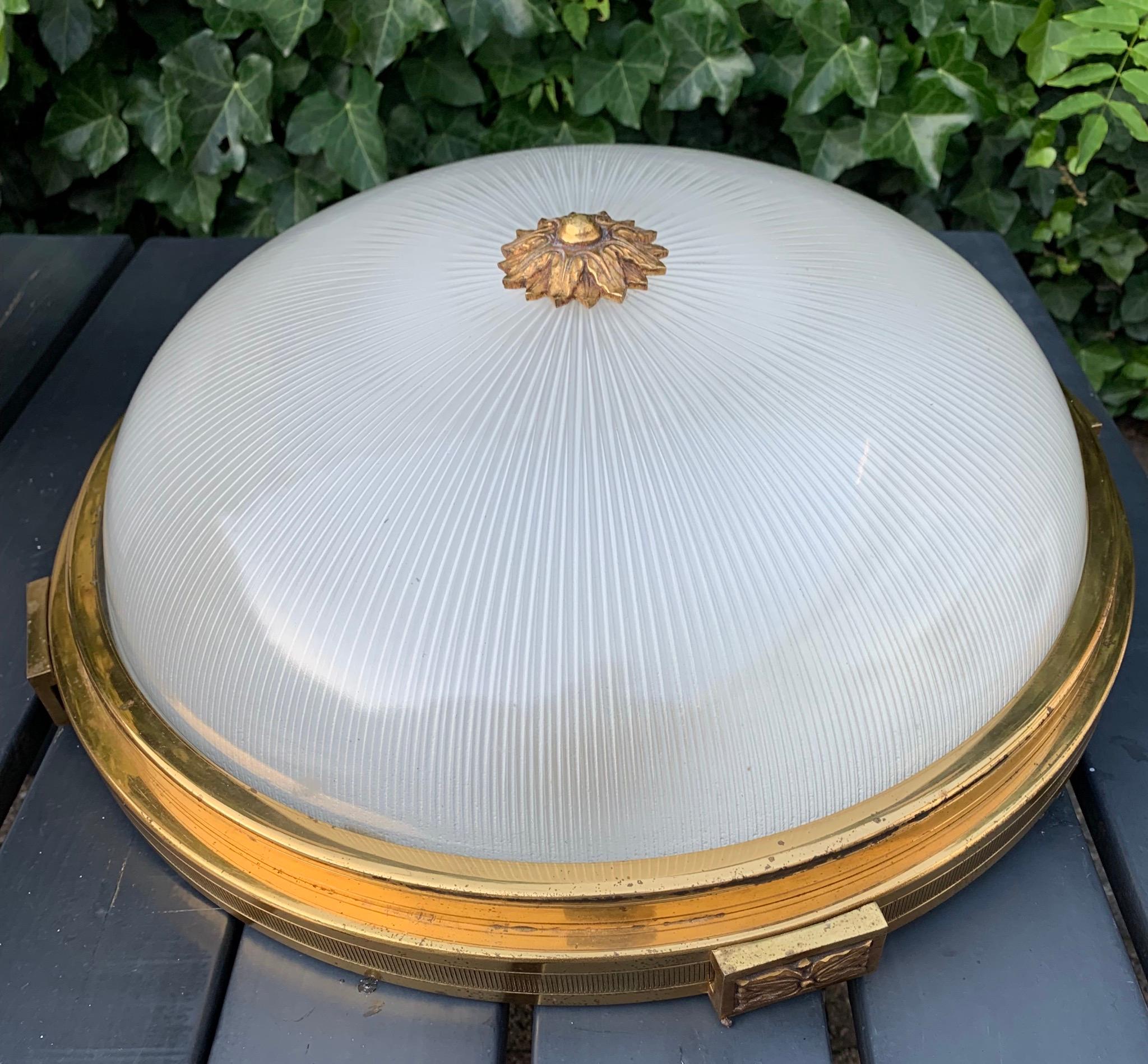 Rare and great looking, early 20th century large Holophane light fixture.

With early 20th century lighting being one of our specialities, finding this rare and extraordinary flush mount more than made our day. It is clear that Holophane have made