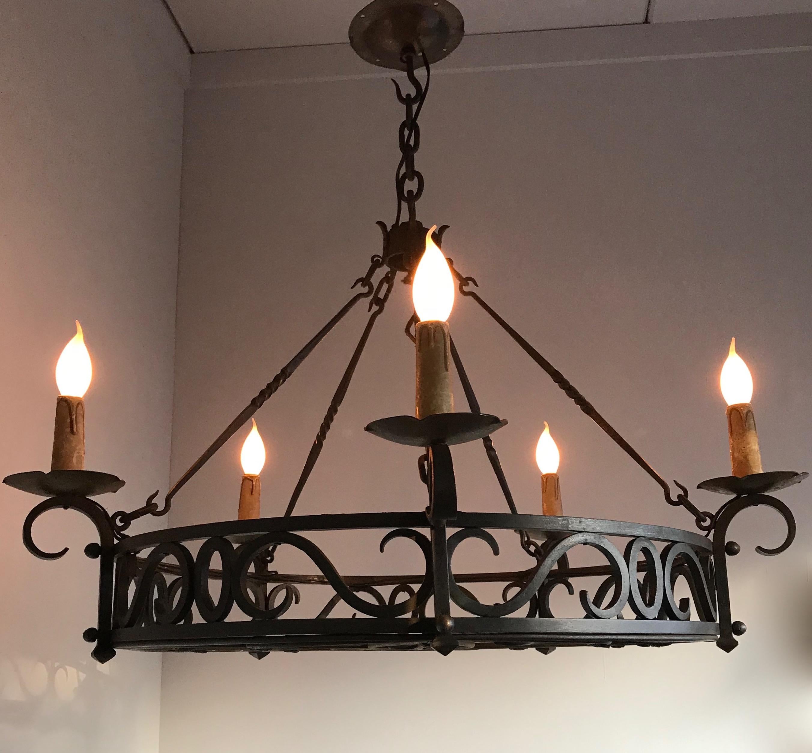 Museum quality, forged in fire castle design pendant light.

This good quality and all hand-forged chandelier comes with beautiful and artistic details which certainly lifts it above the average. In the right space it will look the business and we