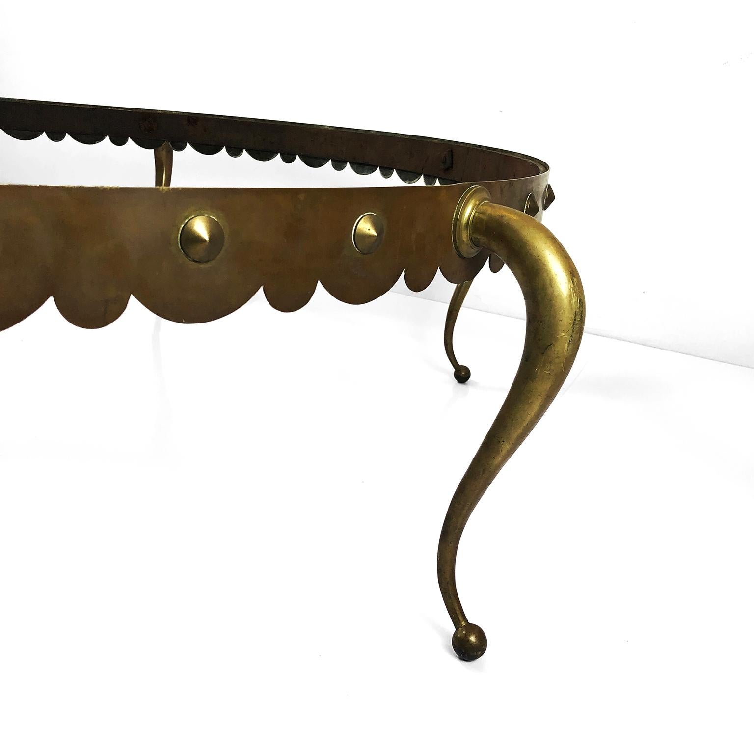 This large cocktail table is one of the most iconic designs of Arturo Pani, the table are made in solid bronze whit spectacular legs design, circa 1960.

Note: The cost includes the top glass or it can be discounted for the purposes of better