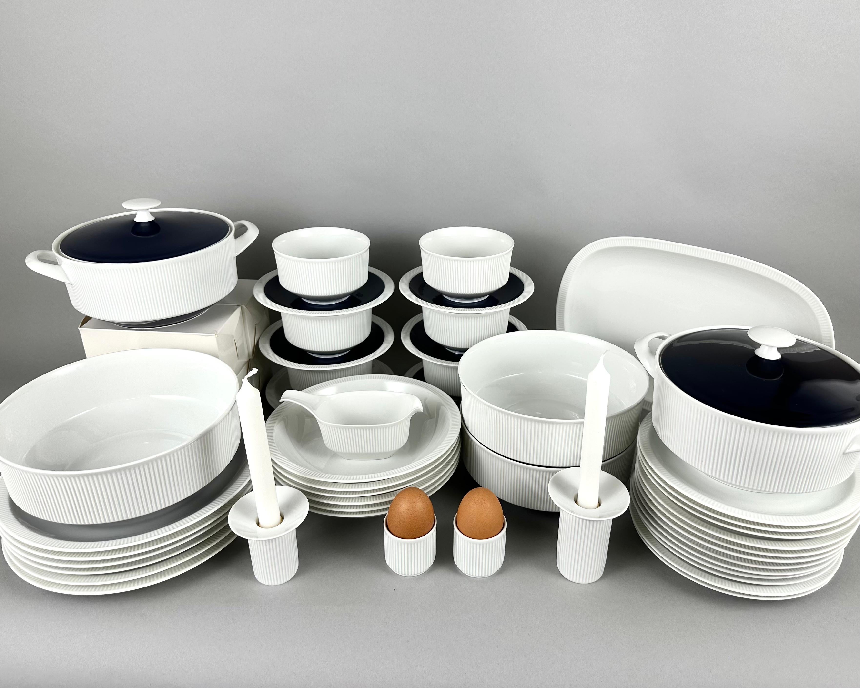 Set of coffee and dinner ware service vintage by Arzberg, 1970s. Germany.

White porcelain with relief stripes, dark blue lids and saucers.

It consists of:

 1. Turin - (14 cm) - 2 pcs.

 2. Bouillon bowls with saucers - 6 pcs.

 3. Large salad