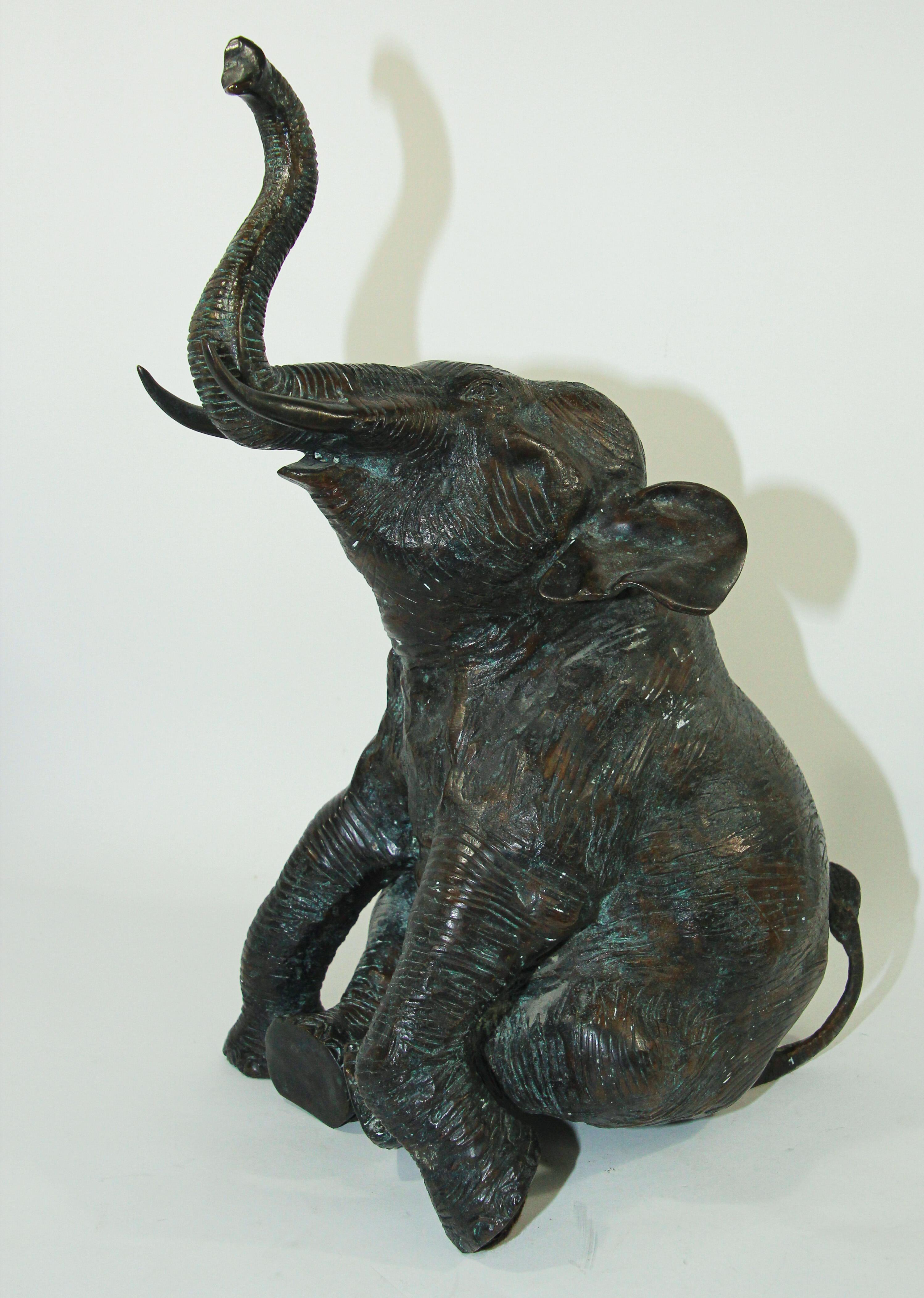 Large Asian style metal bronze sitting elephant with raised trunk
Bronze elephant figurine statue cast metal sculpture Art.
Verdigris finished cast brass Elephant
Elephants bring good luck and good health with trunk up, 
Dimensions : 9.5