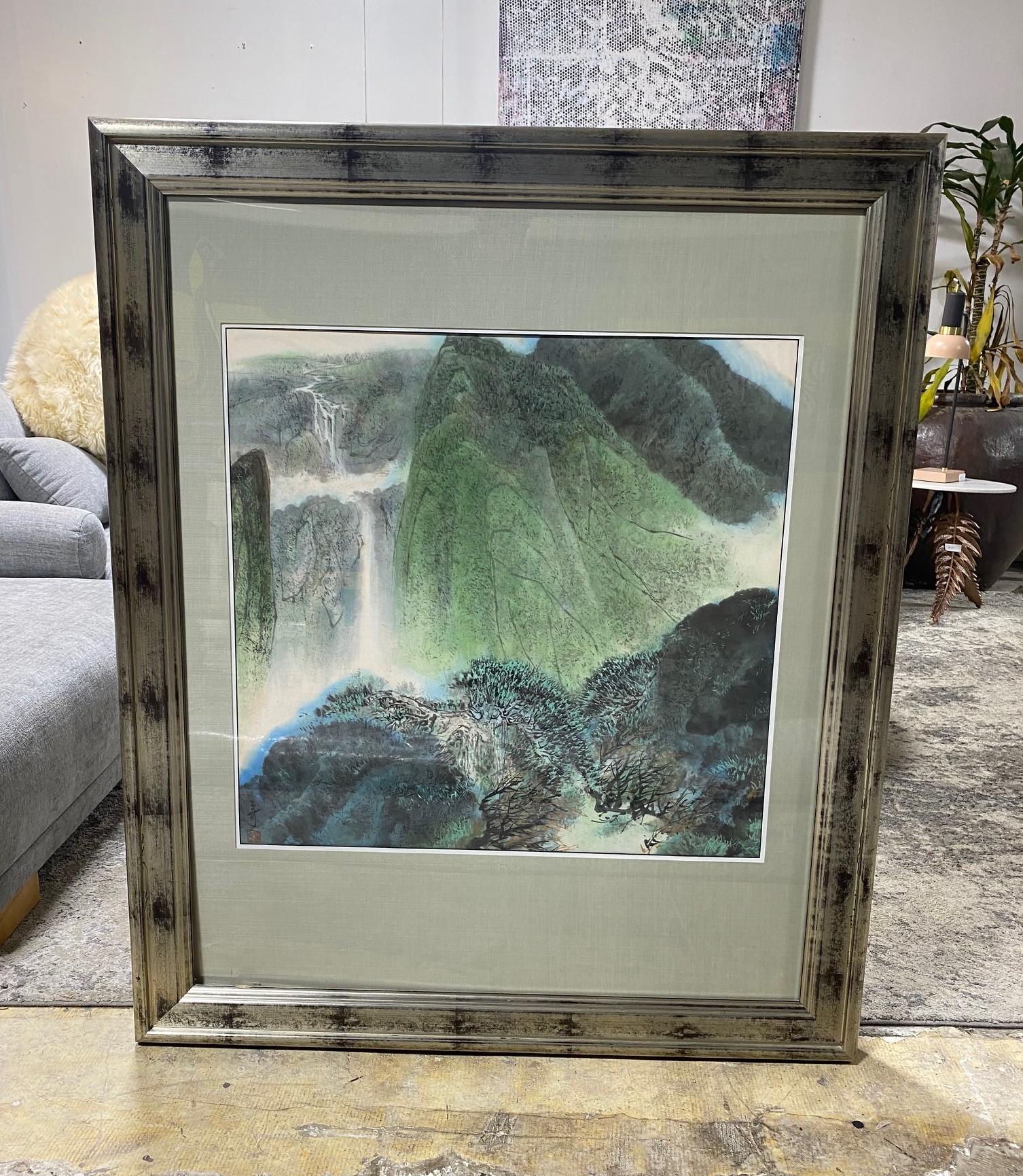 A goregous Asian watercolor painting featuring a luscious green natural mountainous landscape with a flowing waterfall and soft delicate misty light. We were told the piece was Japanese but we think it is either Chinese or Korean. 

The work is