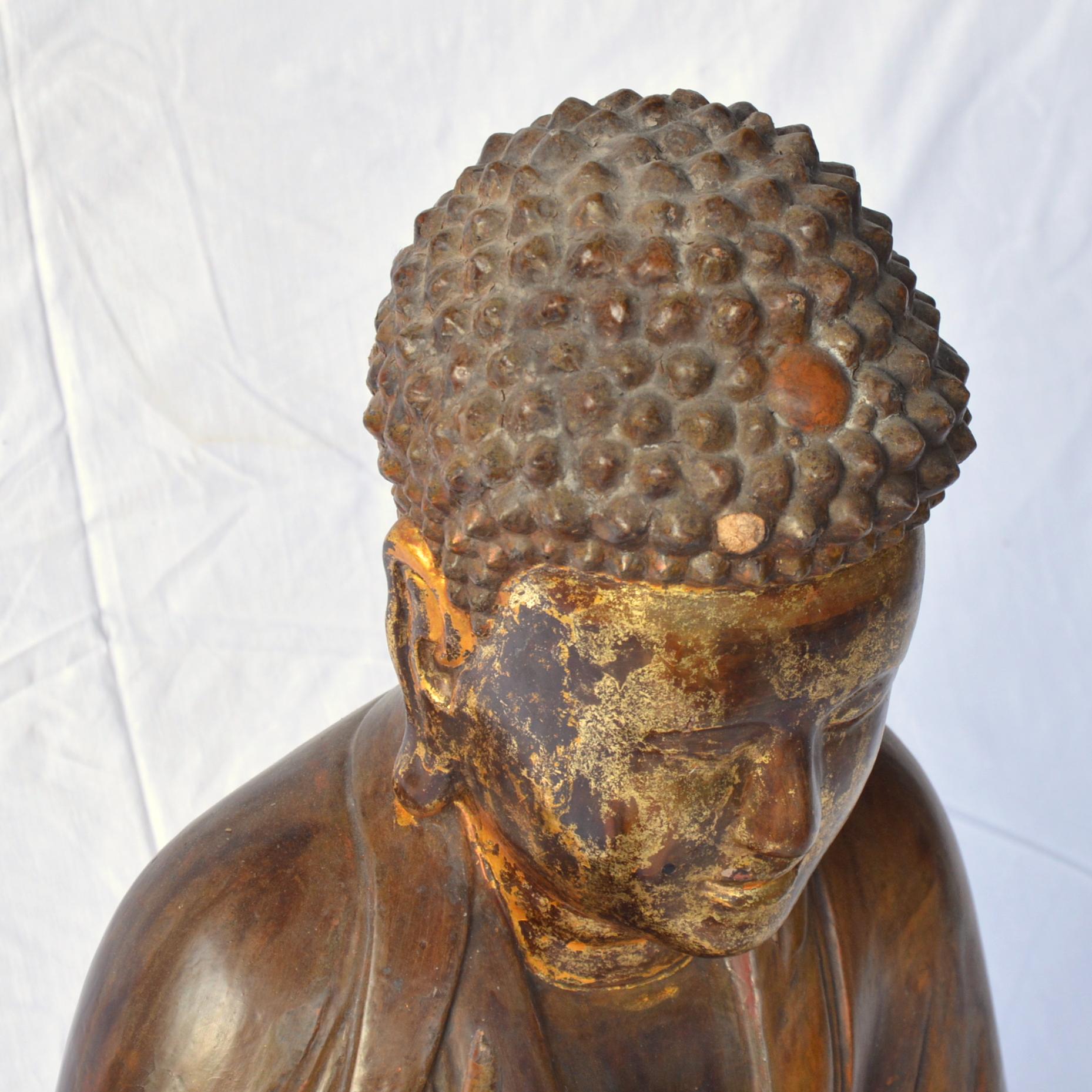 Carved Large Asian Patinated and Gilt Buddha Sculpture For Sale