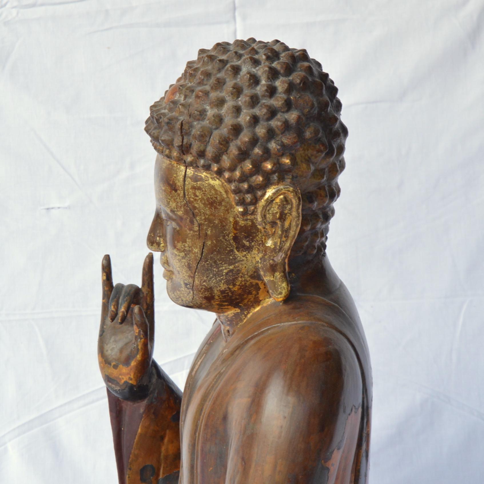 Wood Large Asian Patinated and Gilt Buddha Sculpture For Sale