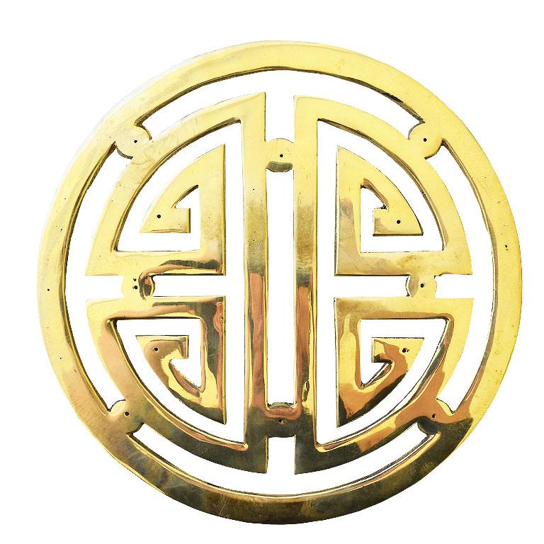 Large round solid brass decorative cabinet or door hardware. Created from a shiny golden brass, this lucky chinoiserie architectural element will be fabulous to add to credenza doors, bedroom doors, or cabinet doors. Each piece can easily be affixed