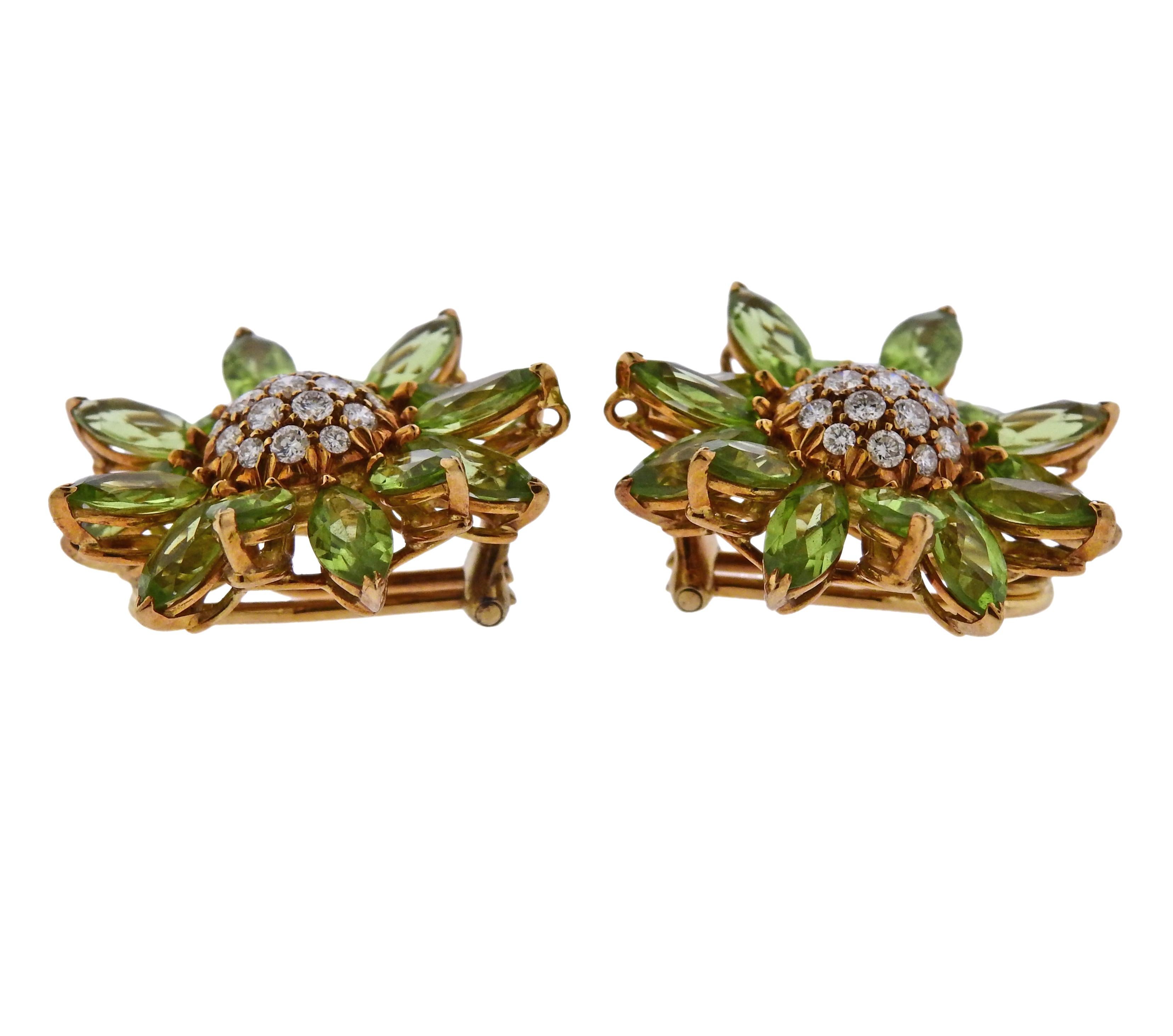 Pair of 18k yellow gold Heritage Daisy earrings by Asprey, set with approx. 1.00ctw in G/VS diamonds in the center, and peridots. Earrings are 27mm in diameter and weigh 18.7 grams. Marked 18Kt, 750, Asprey. 