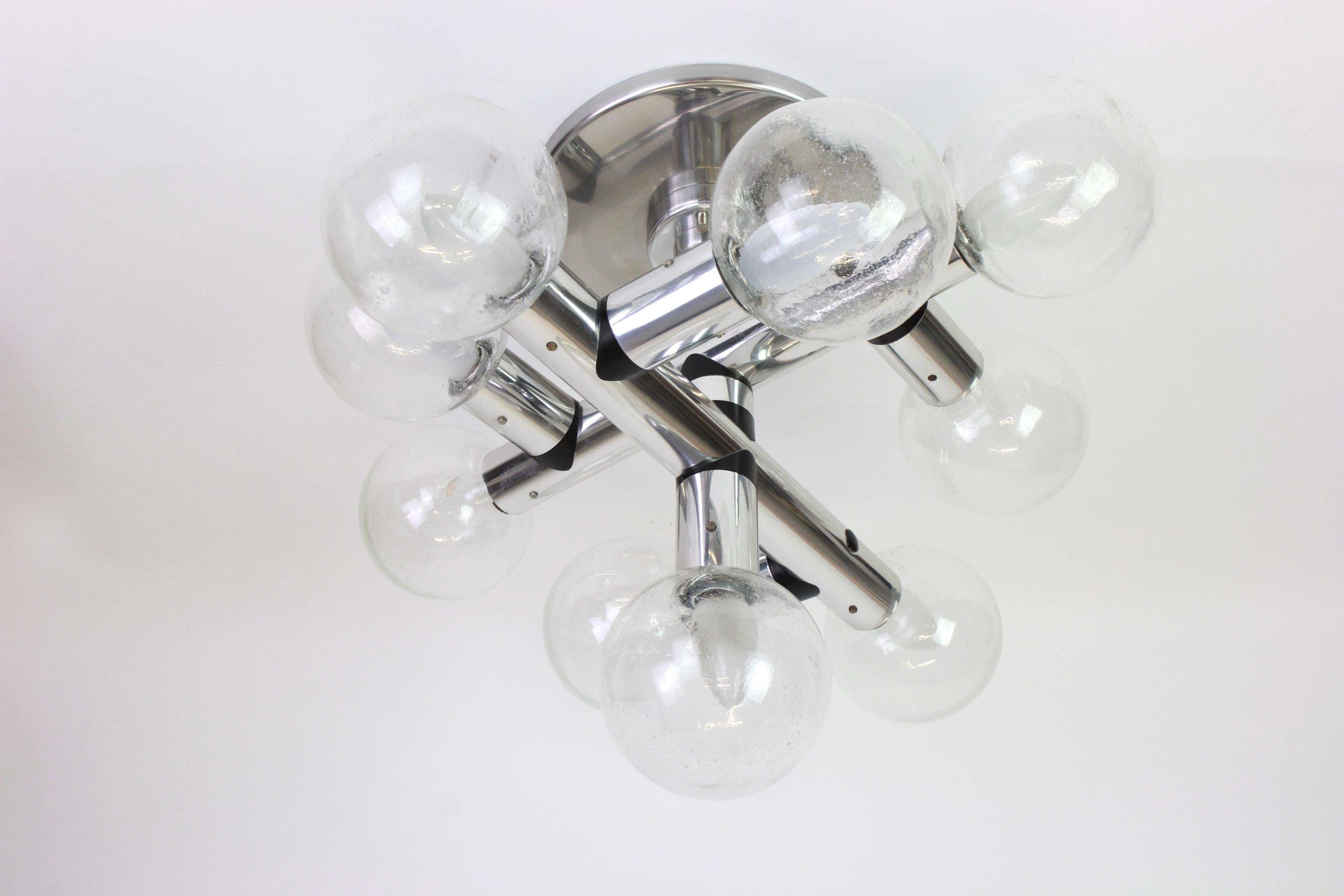 Exclusive sputnik light fixture designed by Kalmar during the 1970s with nine bubble glass ball on an Alu frame.

Heavy quality and in very good condition. Cleaned, well-wired and ready to use.

 The fixture requires nine E14 small bulbs with 40W