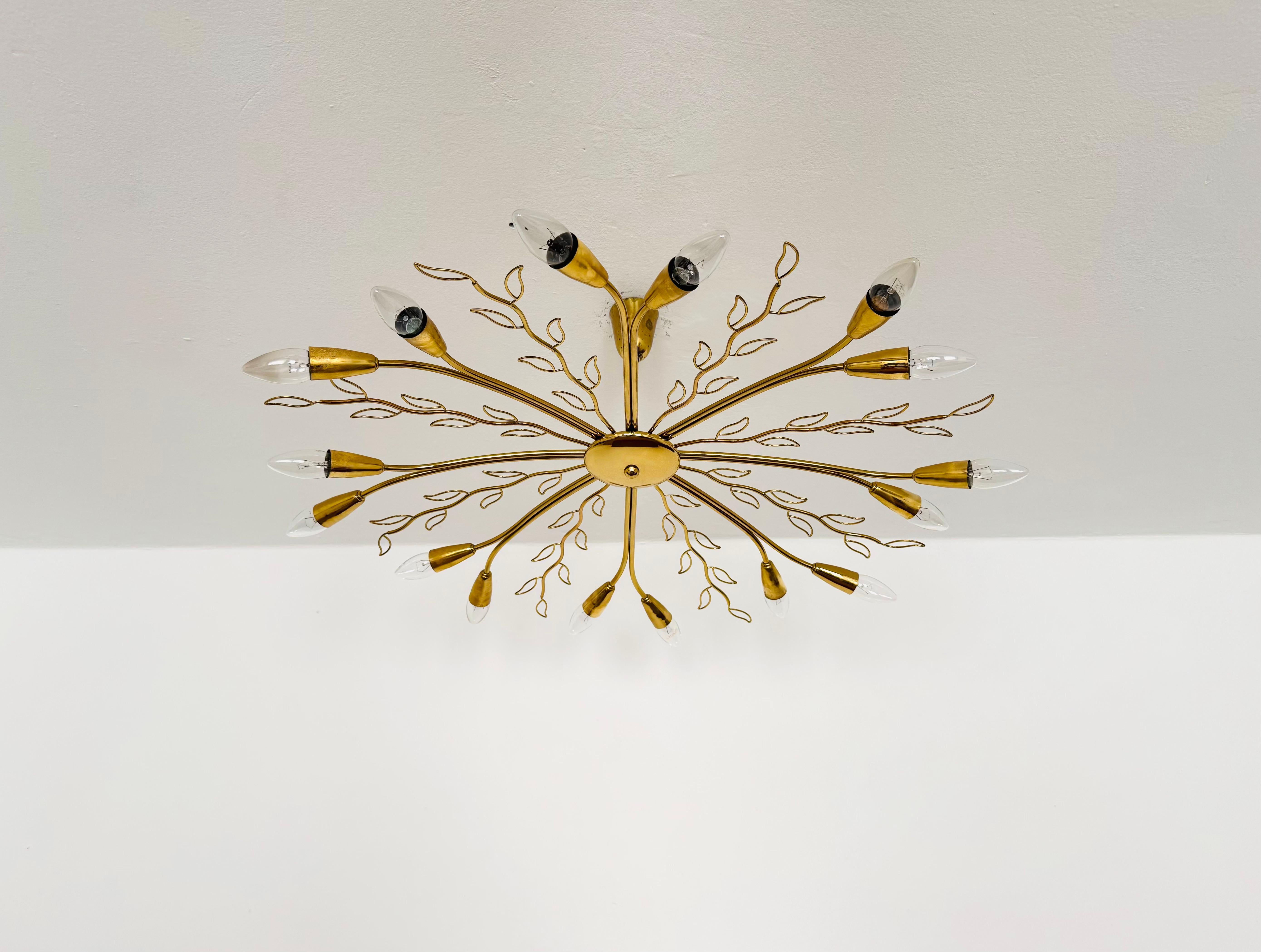 Exceptionally beautiful and large chandelier from the 1950s.
This large lamp is very rare and impresses with its loving details.
A stunning lamp and a true asset to any home.

Manufacturer: Rupert Nikoll

Condition:

Very good vintage condition with