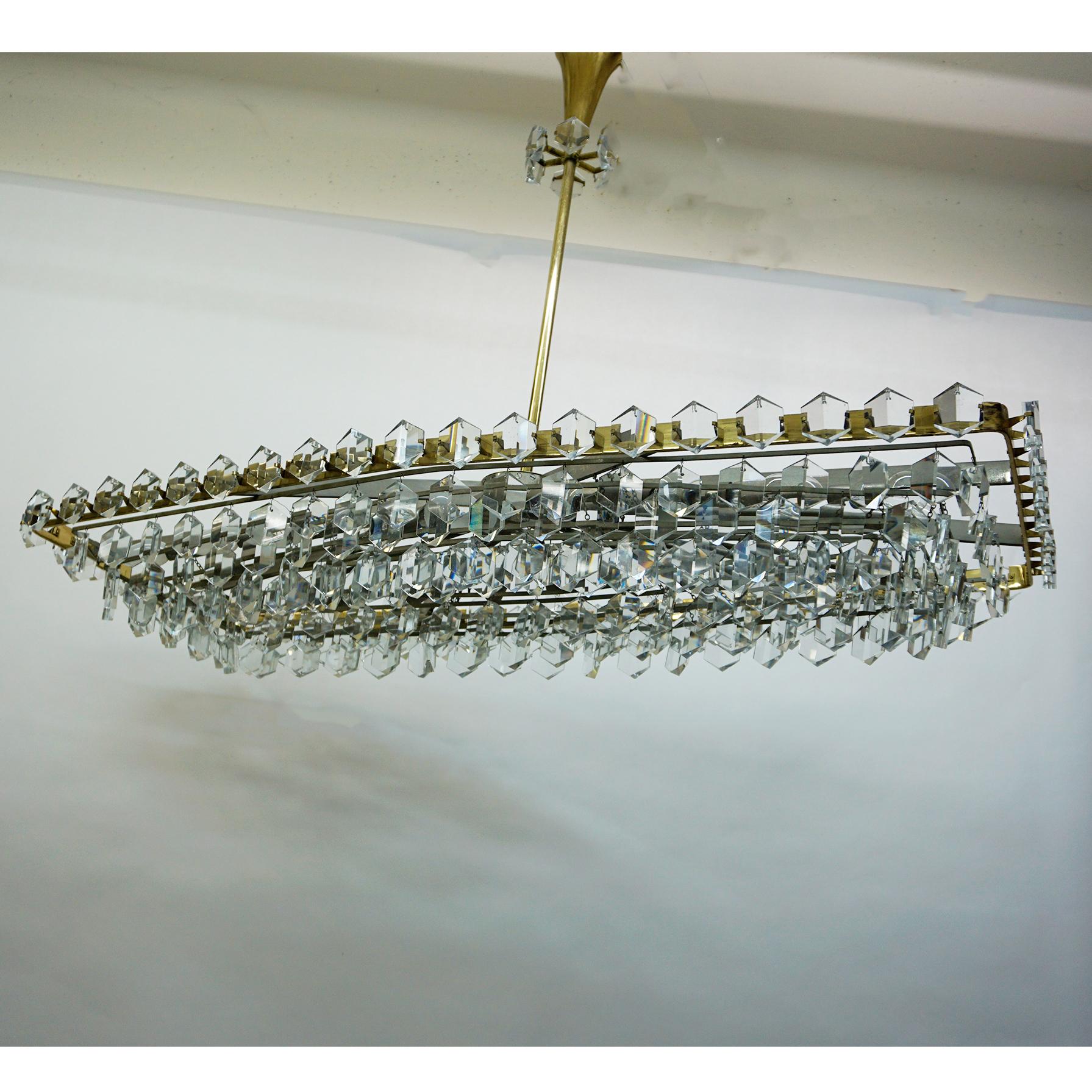 Fantastic and huge square Austrian Mid-Century Modern sparkling handcut crystal glass and brass chandelier designed by Oswald Haerdtl for J. & L. Lobmeyr in the 1950s. It is a variation of the circular Chandelier designed by Haerdtl for the