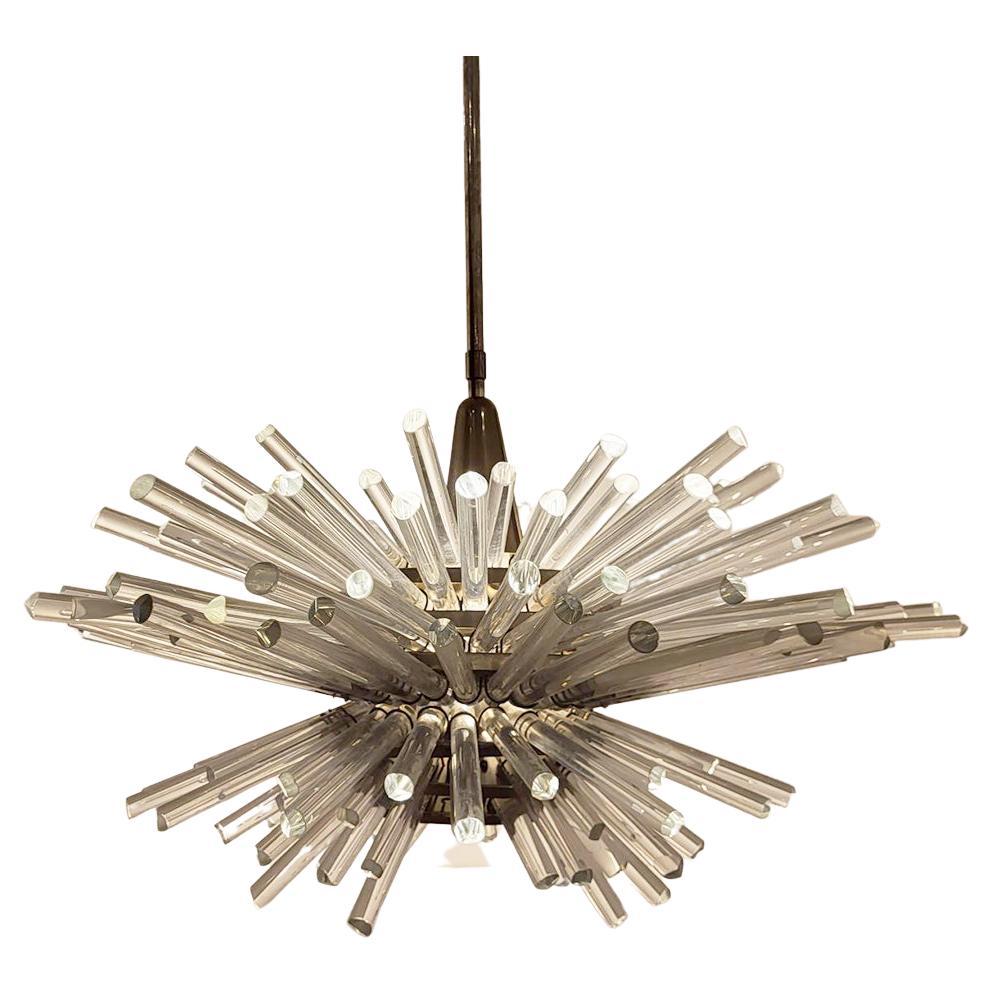 This stunning Miracle chandelier is a very fine design icon of Austria from 1960s. Prof. Friedhelm Bakalowits designed it for his own company Bakalowits & Söhne Vienna.
It features 7 rows of facetted crystal glass rods, and emits reflected light