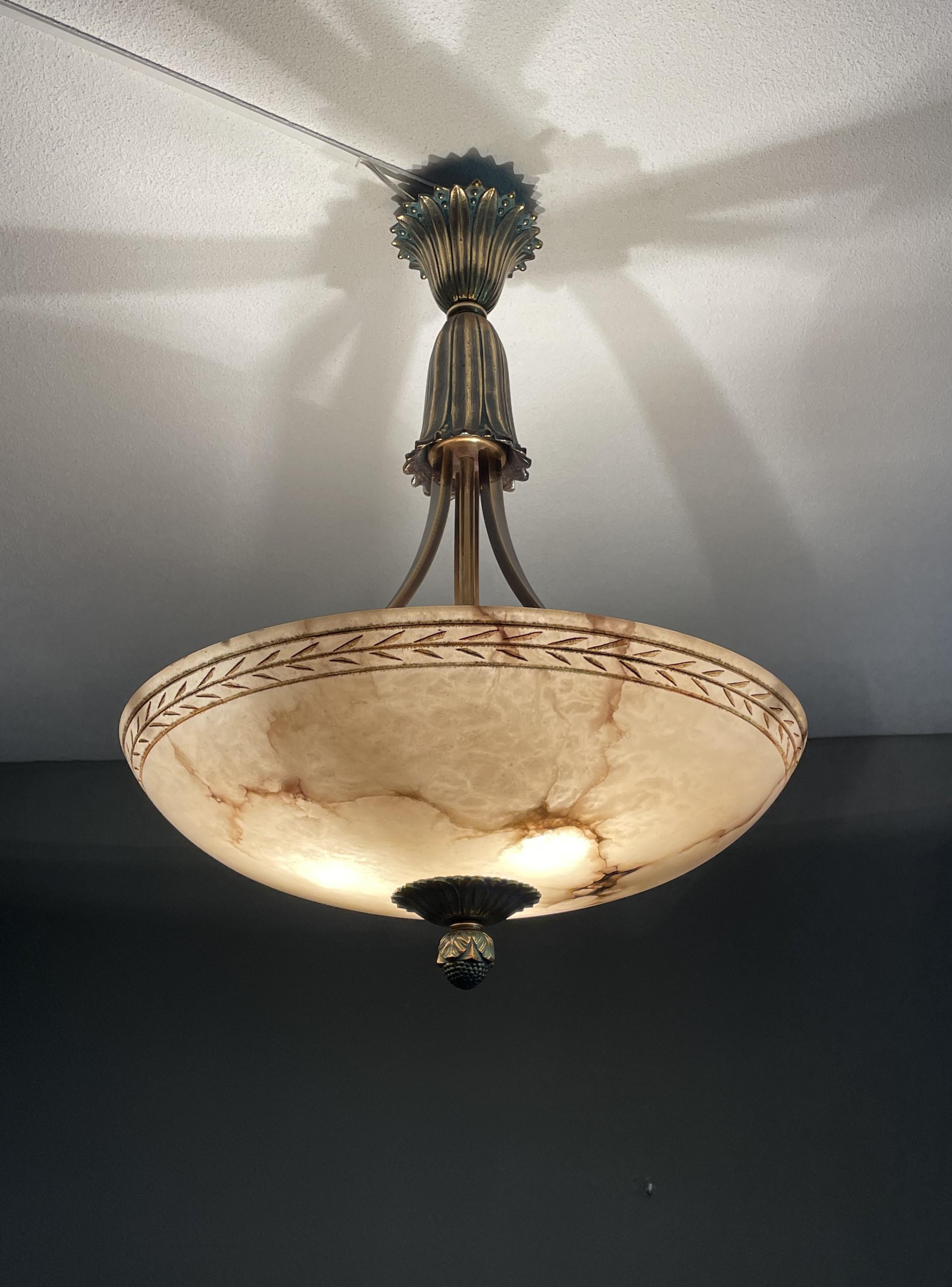 Striking design and impressive size alabaster chandelier.

Over the years we have sold a number of beautiful and unique alabaster light fixtures, but we had never seen one with these quality materials. For it to have found its way to our gallery