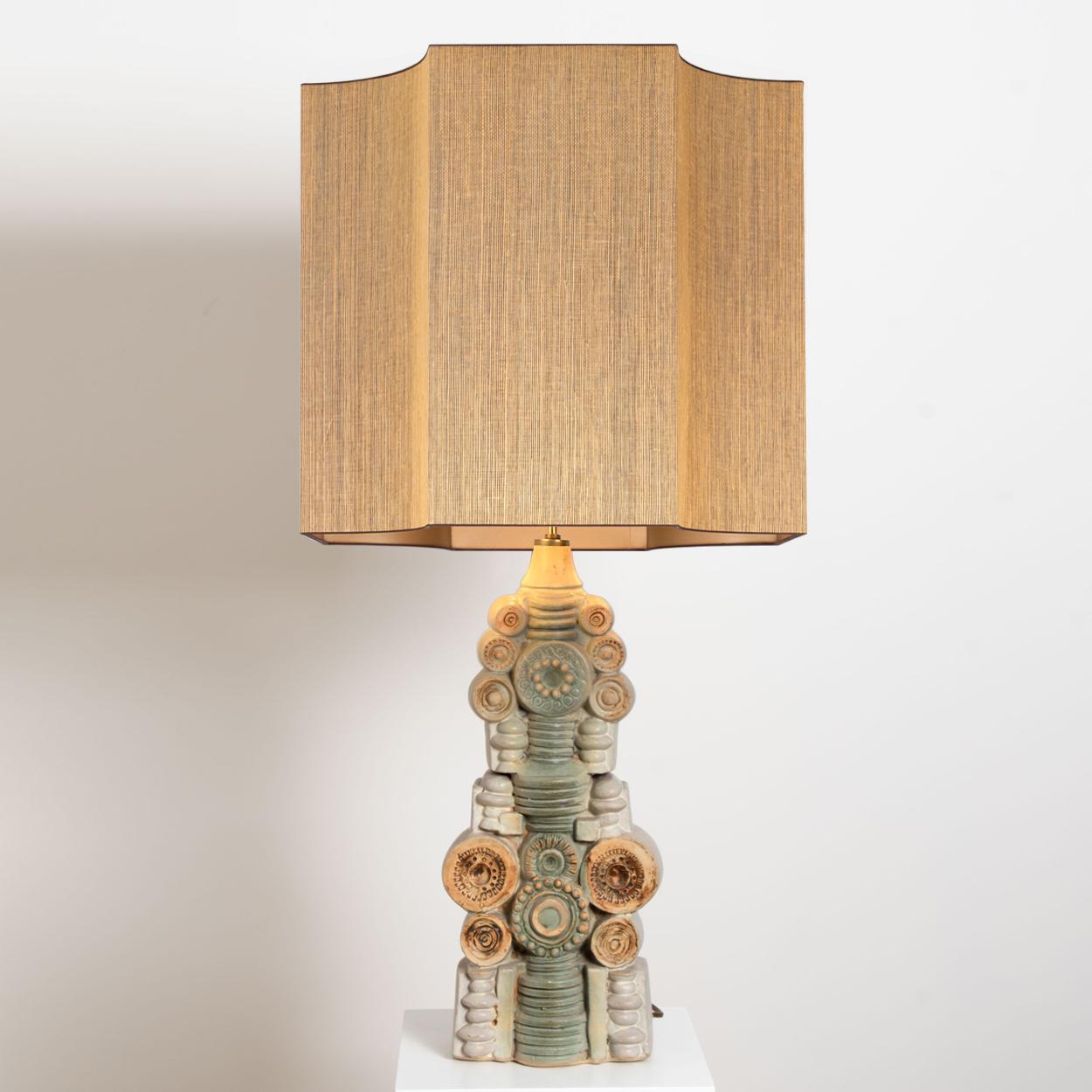 A rare large ceramic table lamp by Bernard Rooke, England, 1960s. Sculptural piece, made of handmade ceramic elements in natural tones of terracotta and stone. With a special custom made lamp shade by René Houben. With warm bronze or gold