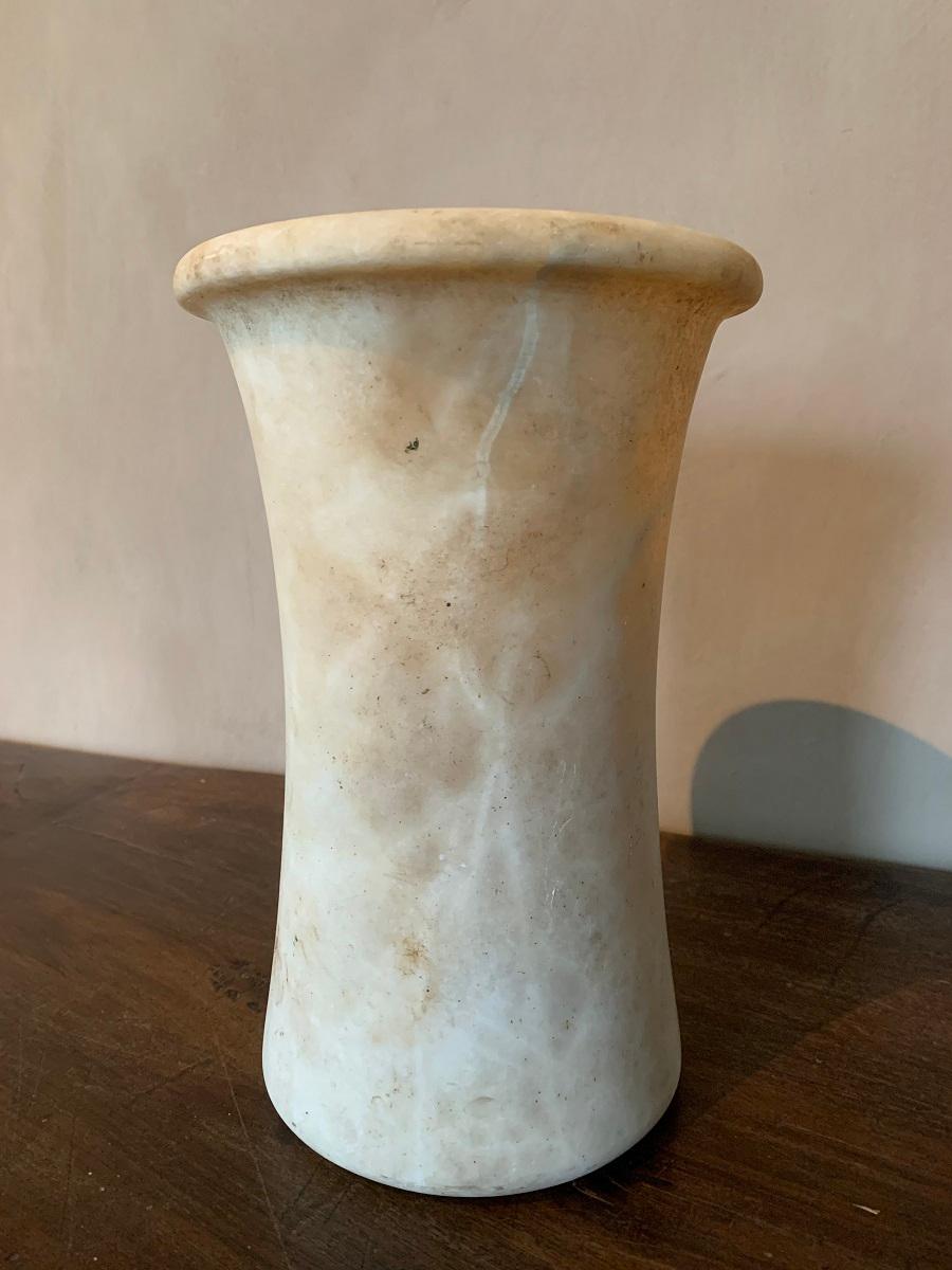 A large Bactrian alabaster vessel or vase, circa 1000 BC, The tubular vessel with a slightly waisted profile. Beautiful veining with typical transparency. Nice patina overall, no cracks.

The Bactrian culture was discovered by Soviet archeologists