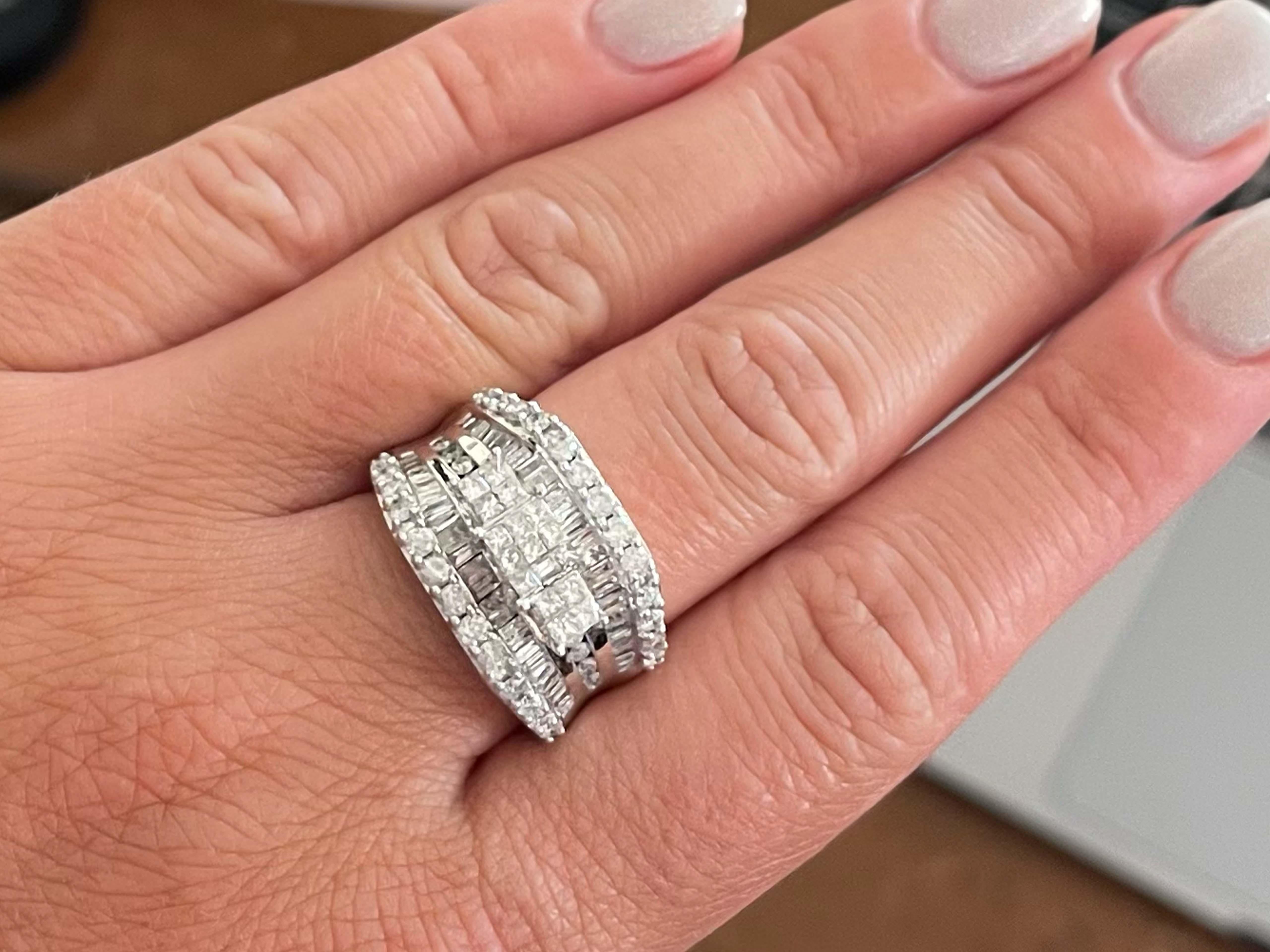 Item Specifications:

Metal: 14k White Gold

Diamond Count: 104 diamonds

Diamond Carat Weight: 2.66

Diamond Color: G

Diamond Clarity: SI1-I1

Ring Width: 14.46 mm

Ring Size: 8 (resizable)

Total Weight: 11.5 Grams

Stamped: 
