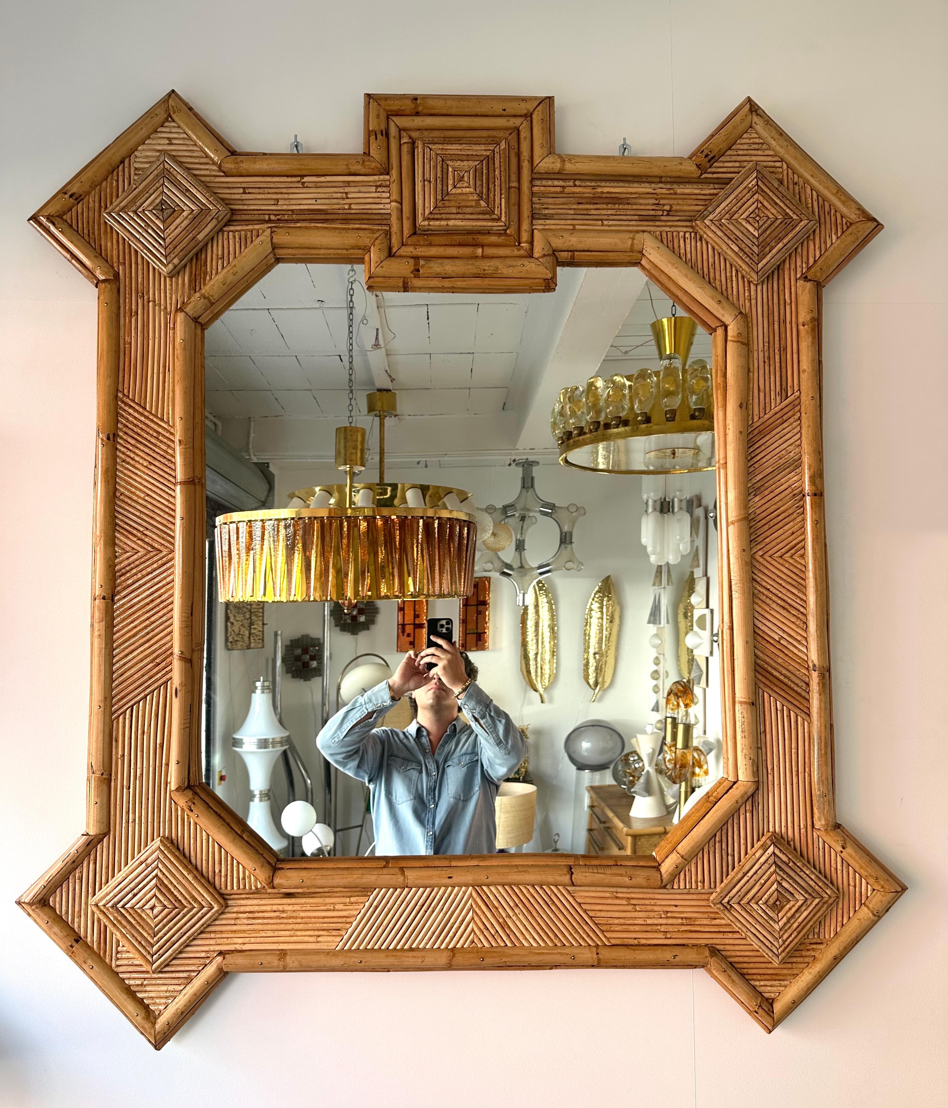 Large Mid-Century Modern Hollywood Regency wall mirror  bamboo, rattan raffia, wicker by the manufacture Vivai del Sud italian design. Original manufacture stamp on the back. Famous design like, Maison Arpex International, Dal Vera, Renato Zevi,