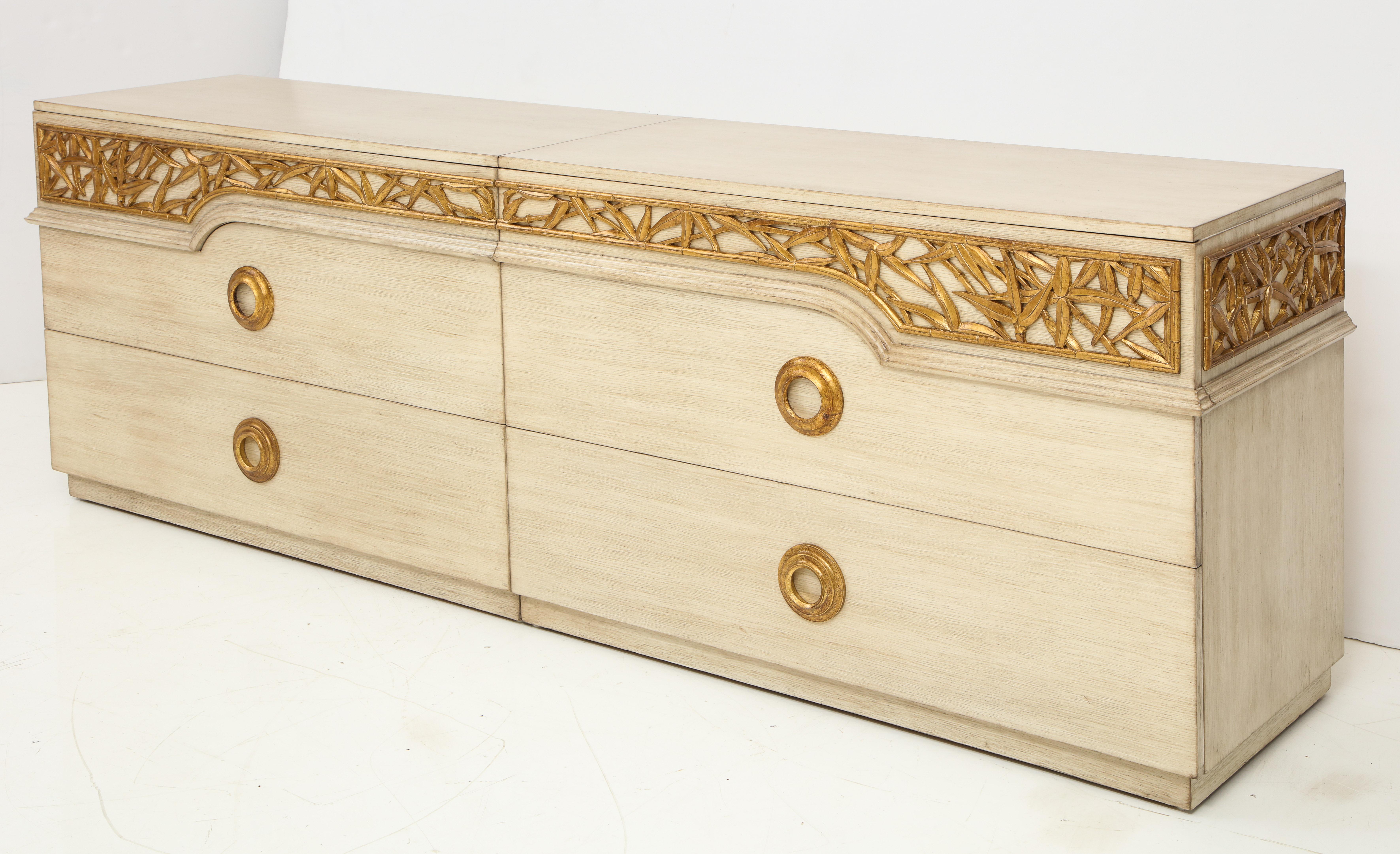 Large bamboo detailed dresser by James Mont.
This large 2-piece cabinet has been restored in a natural driftwood finish and is in Excellent condition and is accented by the beautifully carved gold leaf bamboo detailing.
The cabinet has 6 drawers