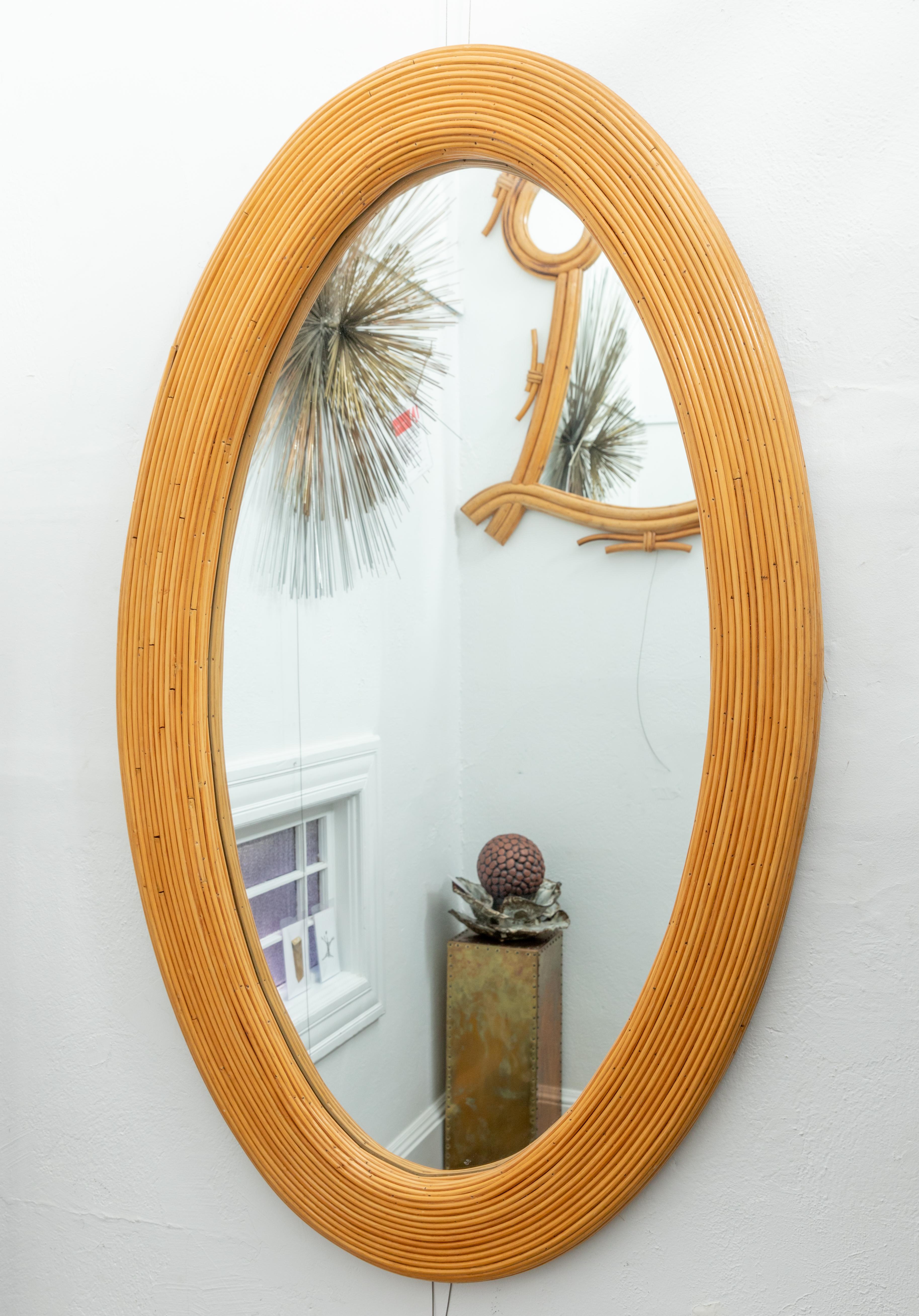 Large bamboo reed woven oval mirror.