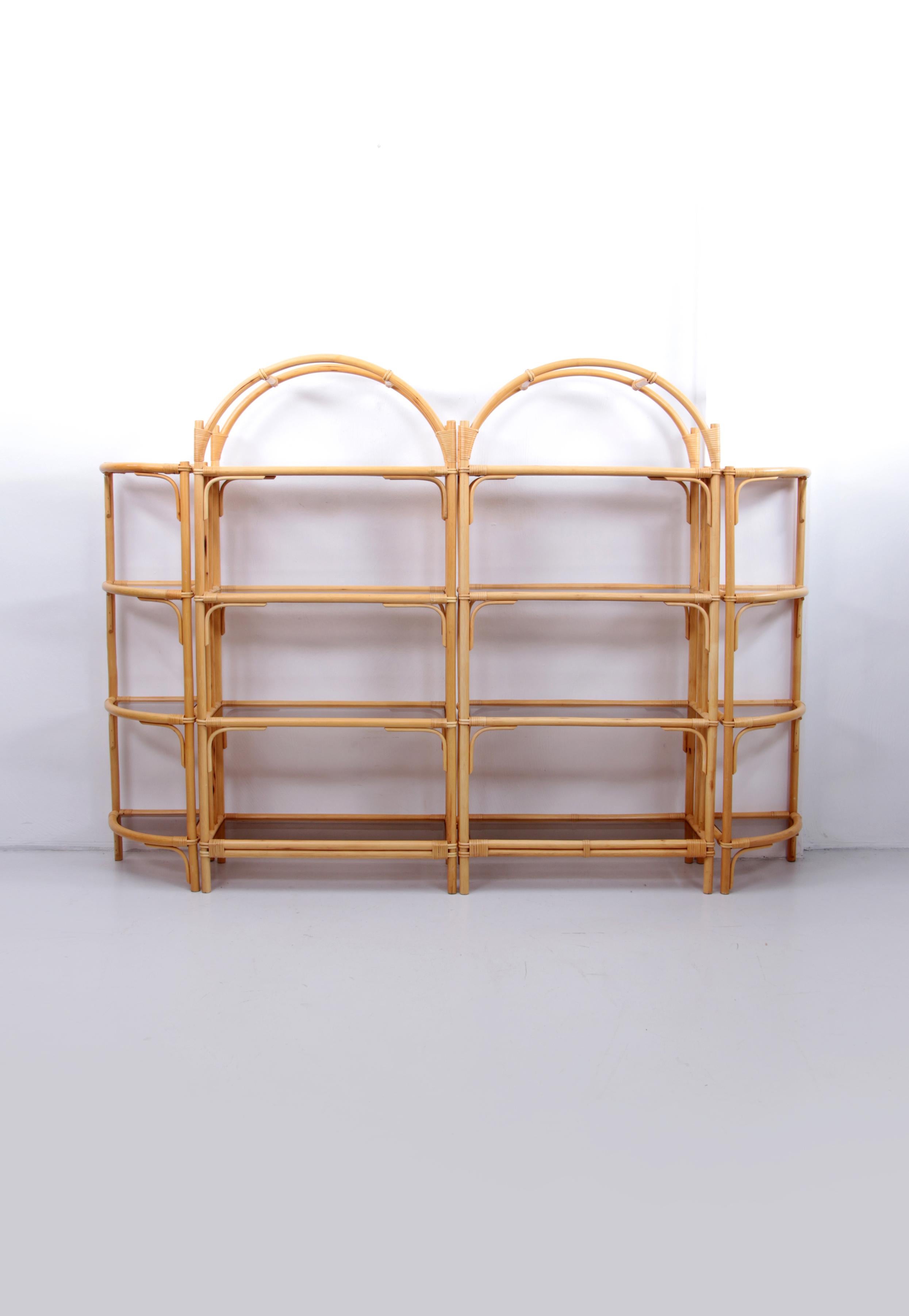 A beautiful bamboo wall unit with curved bamboo freestanding unit or bookcase from the 1970s.

Wonderful Scandinavian feeling, from Denmark.

This piece of furniture is in perfect condition.

The dark glass is also original, the furniture