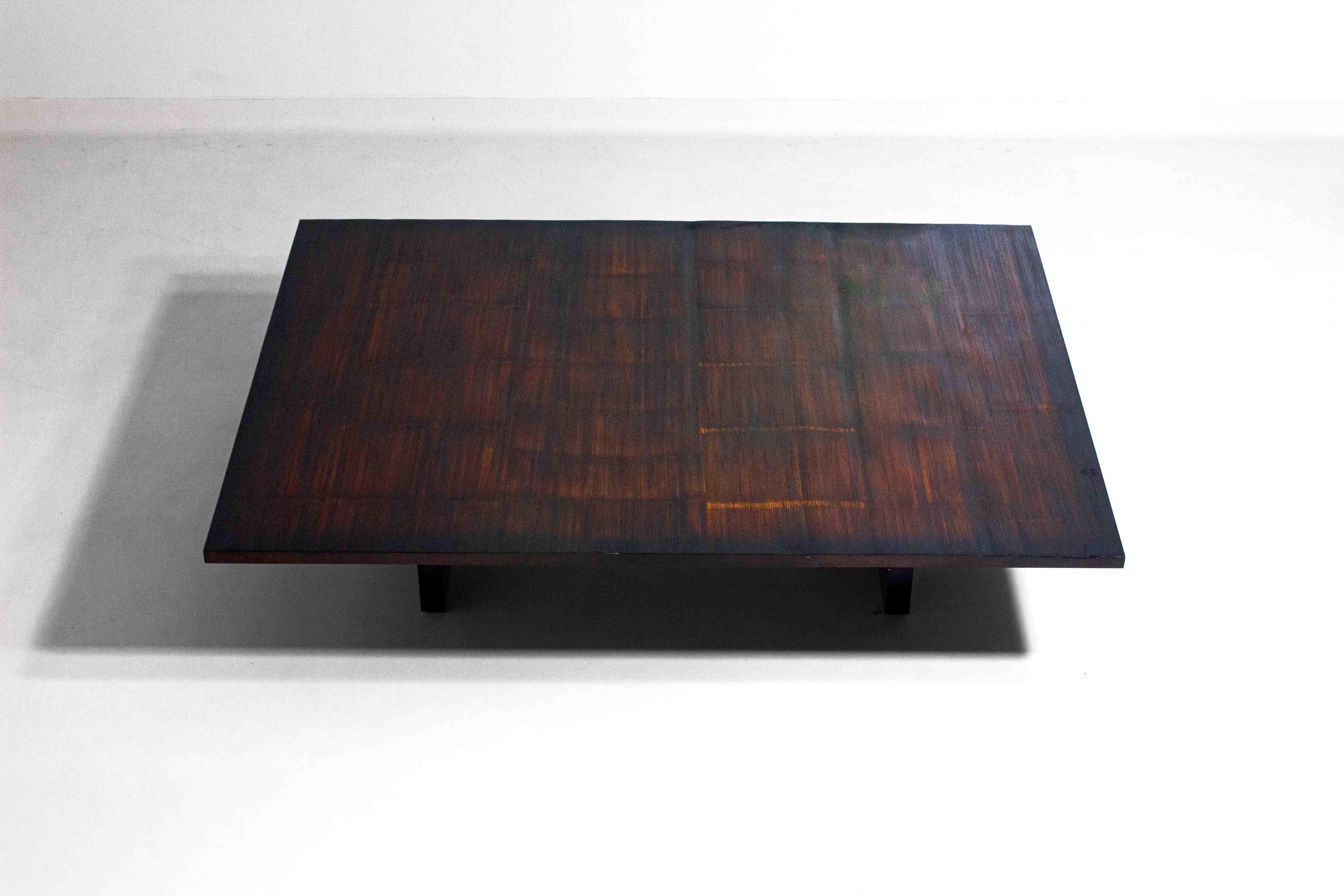 This rare 1980s coffee table, designed by Belgian decorator and art dealer Axel Vervoordt, exemplifies his deep appreciation for natural materials. The table features a harmonious blend of rich wengé wood and bamboo, reflecting Vervoordt’s