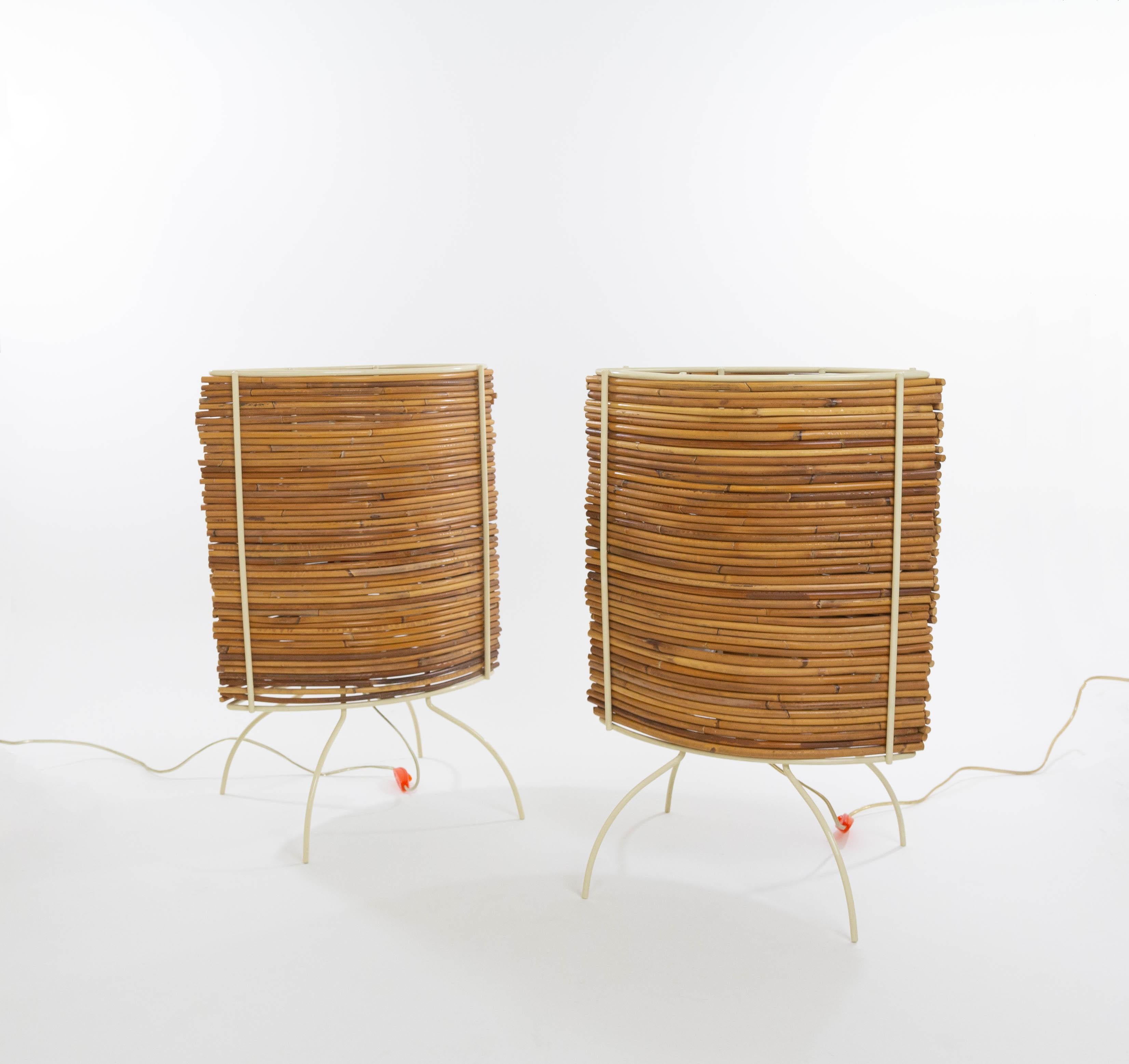 Pair of large Bambù table lamps by Humberto & Fernando Campana for Candle (Fontana Arte).

The model consists of a, seen from above, eye-shaped cream coloured metal frame in which curved pieces of bamboo form beautiful screens. The model was