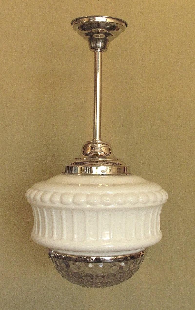 These are late 1920s vintage Bank Lobby, Drugstore, Department Store, or Schoolhouse electric lighting fixtures. They are 2 pieces of glass, milk glass upper and pressed clear glass diffuser, held together by a metal band which can expand to allow