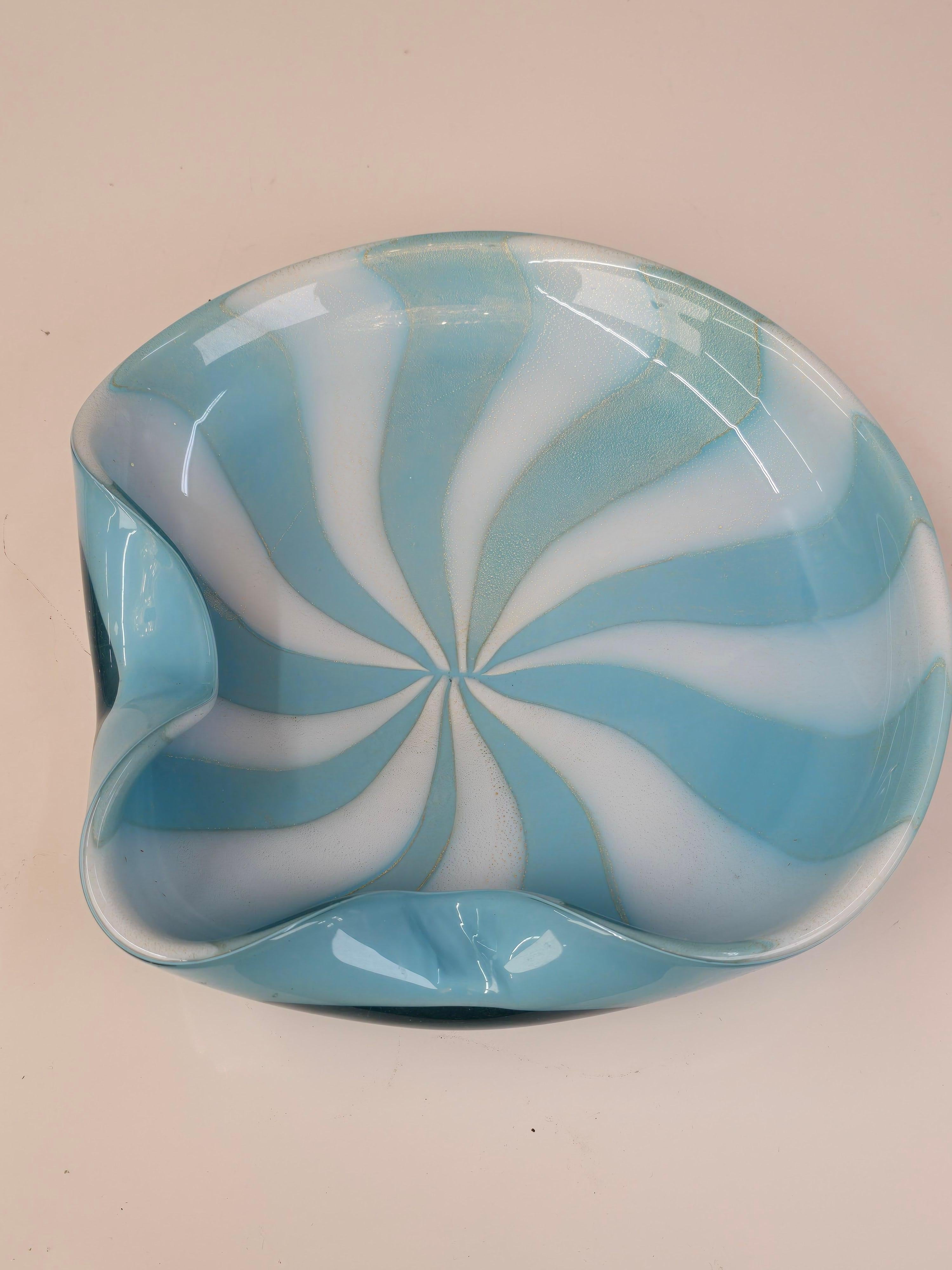 A luminous and beautifully proportioned hand-blown Murano glass bowl by Alfredo Barbini, one of the most revered glass masters of the 20th century. The bowl features swirling layers of baby blue and opaque white glass (known in Murano as lattimo)
