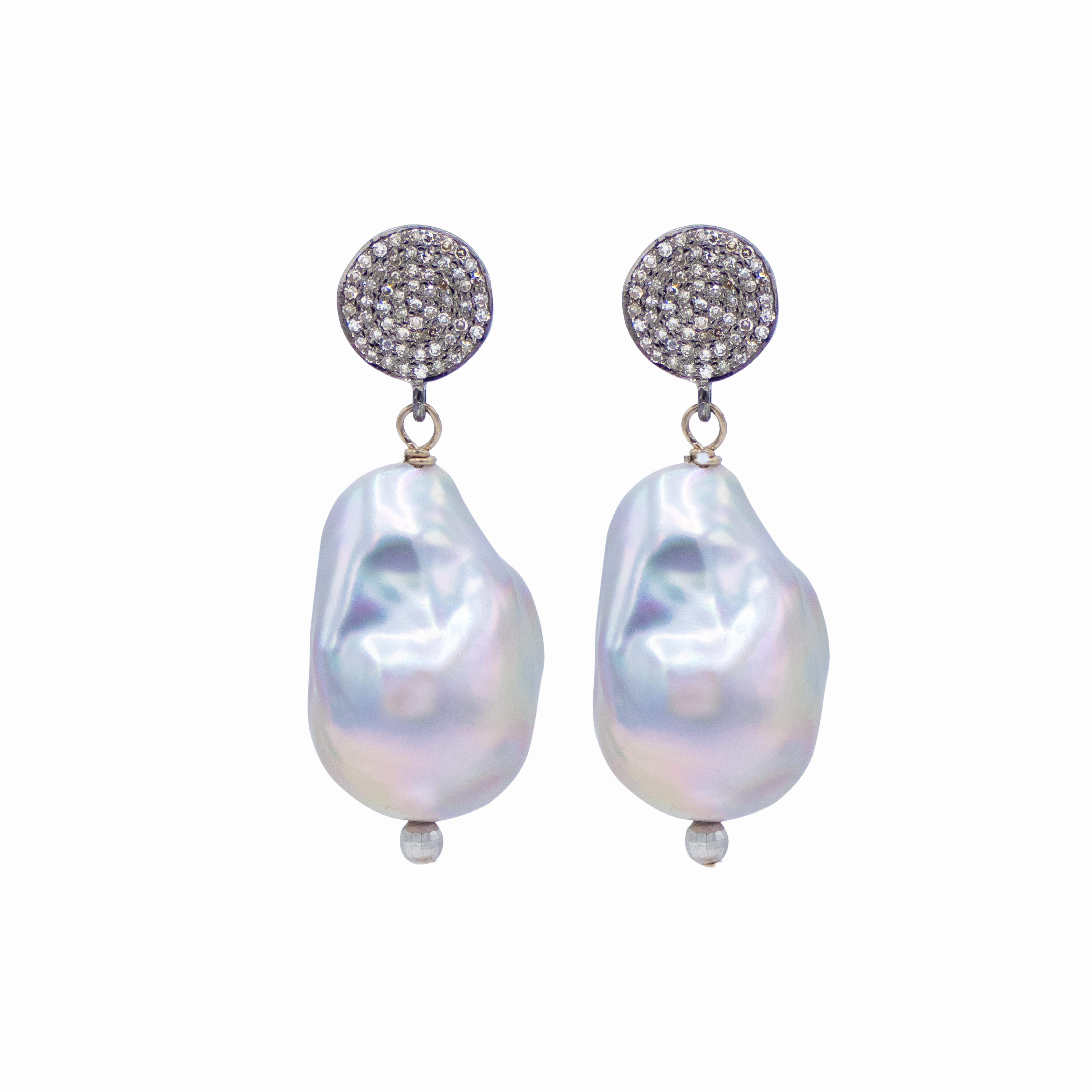 Description
These exquisite large silver-grey baroque freshwater pearl earrings showcase a mesmerizing luster and unique organic shapes, each one a natural work of art. Their captivating iridescence lends an air of effortless sophistication and