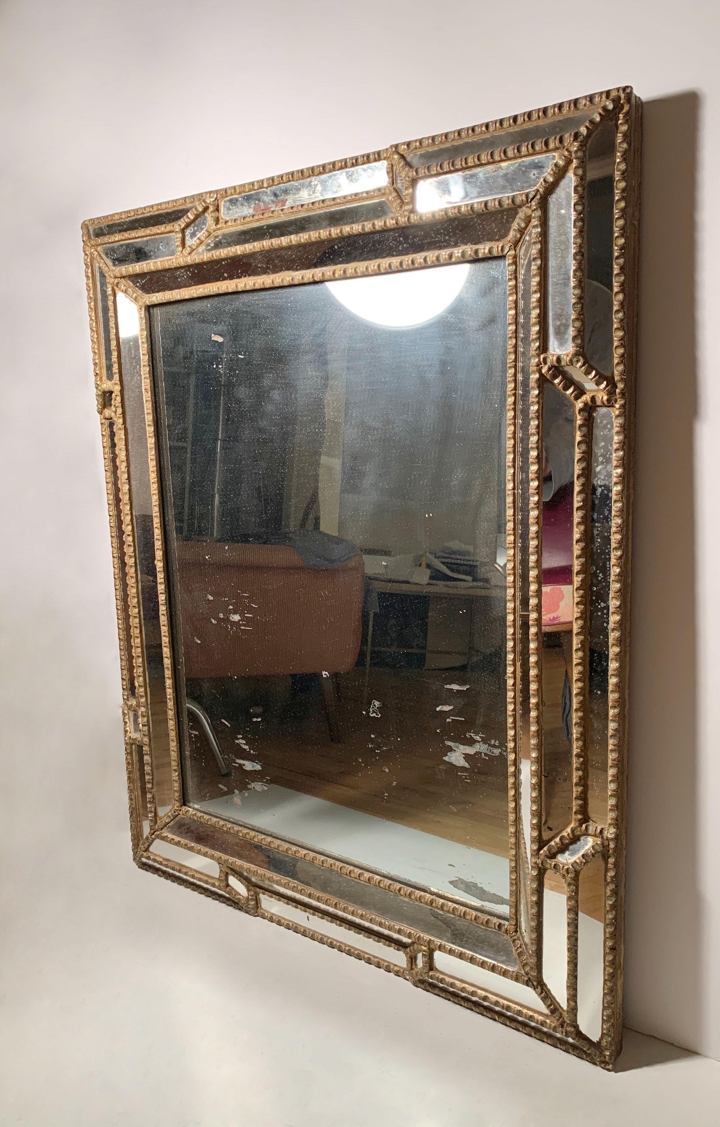 Impressive Baroque mirror looks to be dating to the 19th century possibly earlier. Has an impressive design that is eclectic to work well in a French Modern or Deco interior. Note the detail photos for a sense of it's age. Appears to be Italian in