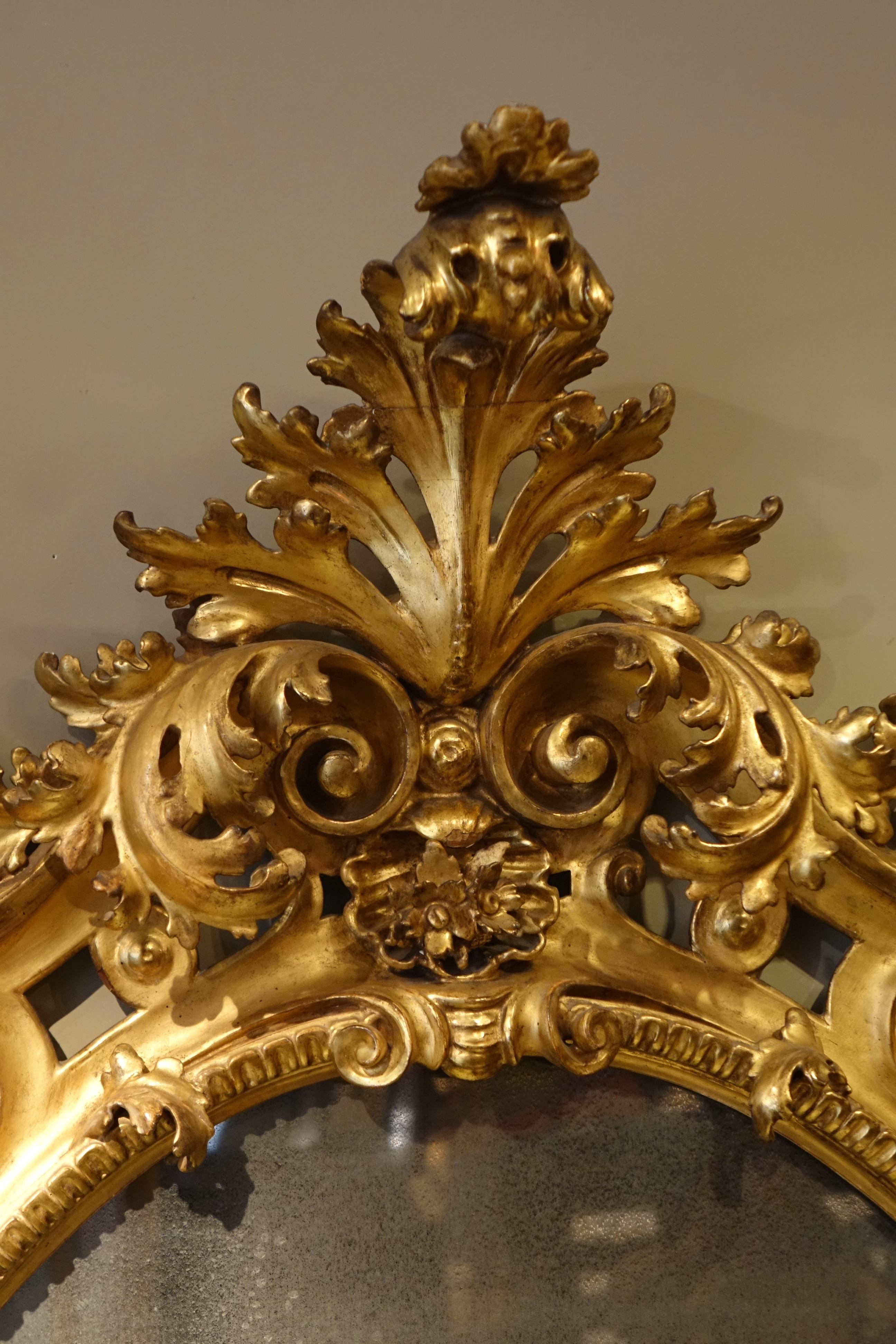 Italian Large baroque mirror in carved and gilded wood, Italy 19th century For Sale