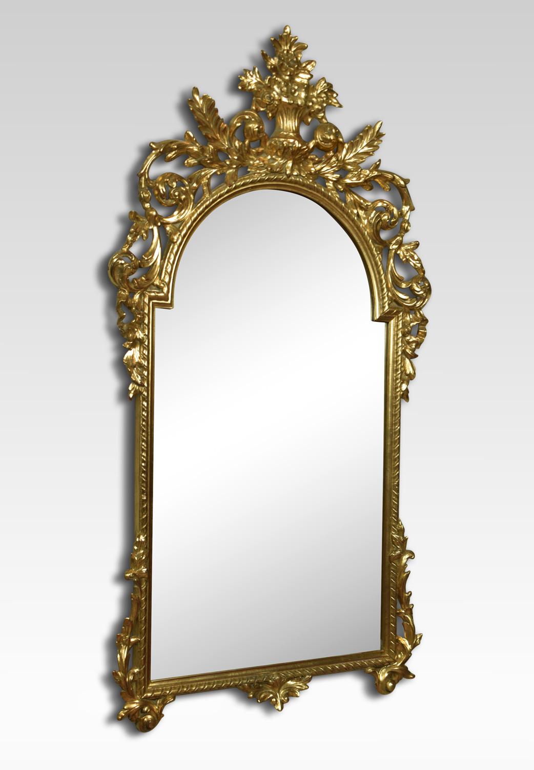 Baroque style giltwood wall mirror, with floral basket crest over pierced and carved frame surrounding original mirror plate.
Dimensions:
Height 55.5 inches
Width 30 inches
Depth 2.5 inches.