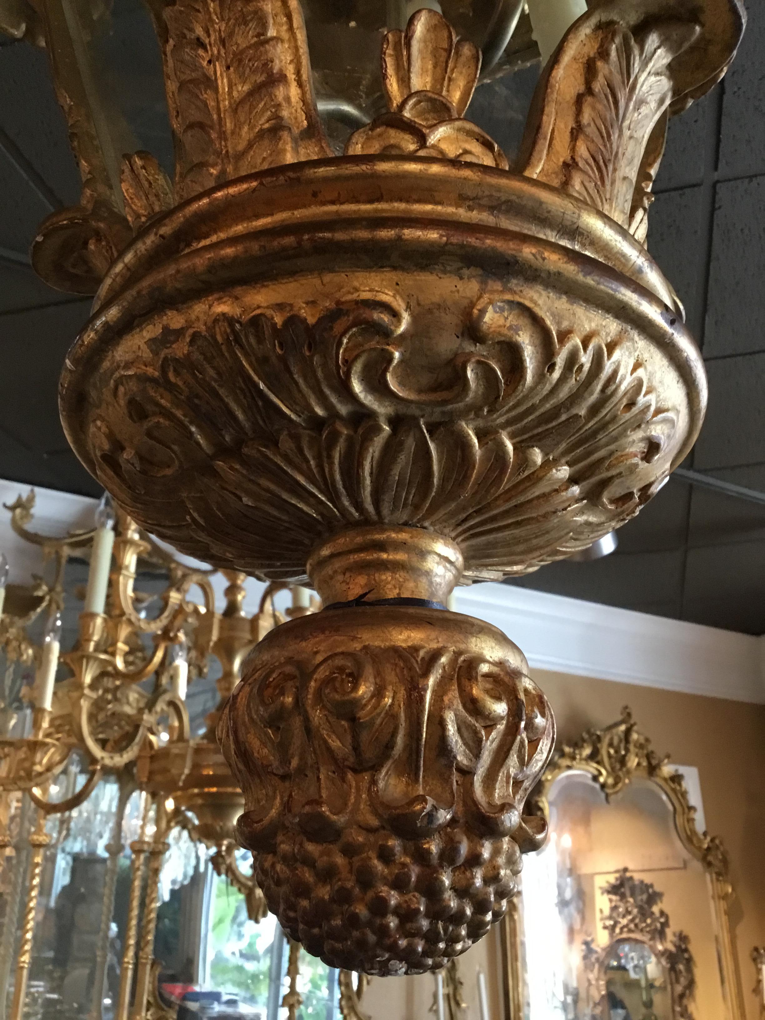 Handsome and impressive gilt carved wood lantern chandelier
Having 5 lights with wax sleeves.