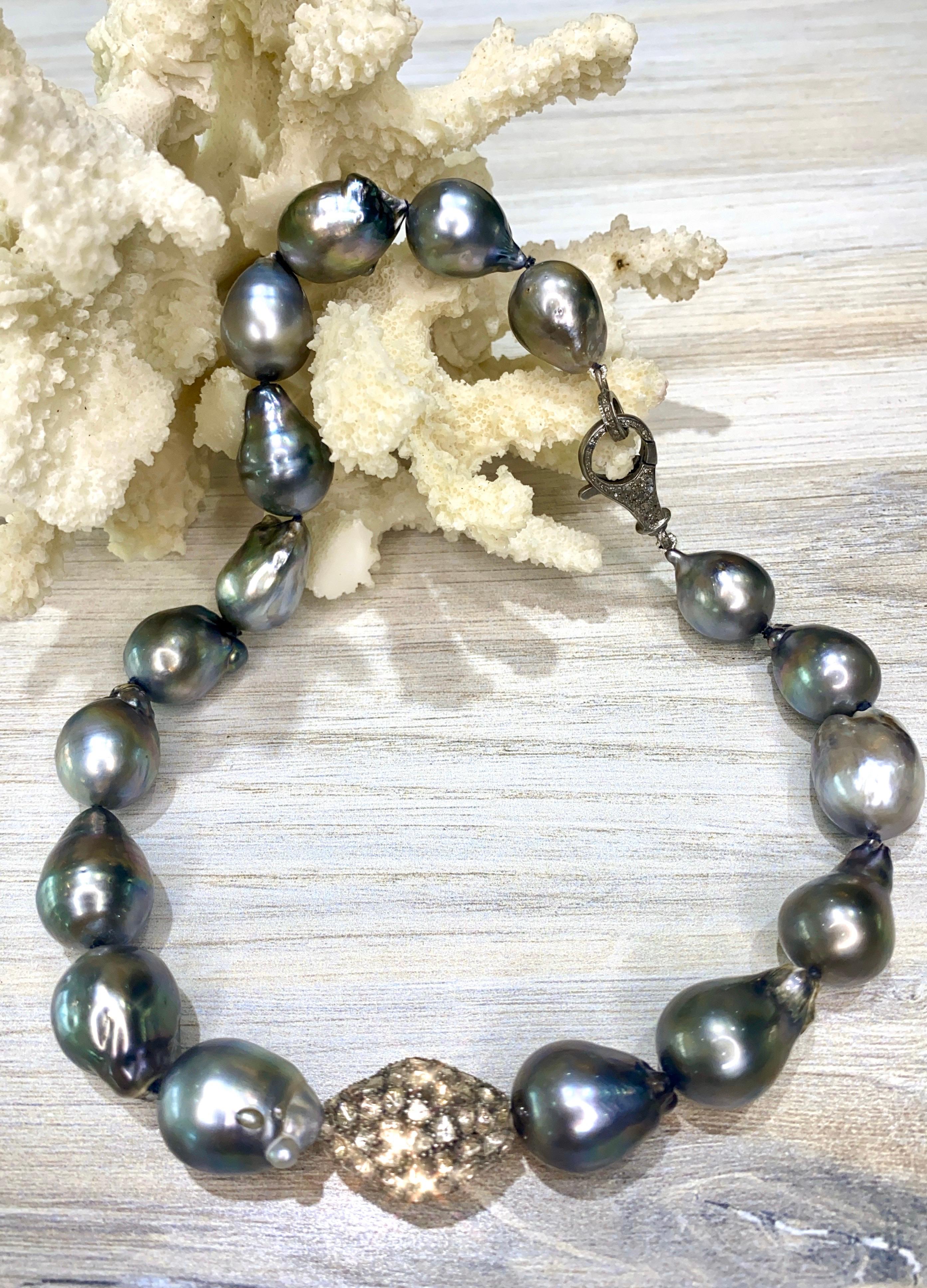 Big beautiful Tahitian pearls are always in style!  This necklace boasts 16 - 17.5 mm HUGE baroque Tahitian pearls, AAA quality, mirror-like luster, and metallic grey color.  The necklace is accented with a large rose-cut diamond bead, 6.5 carats